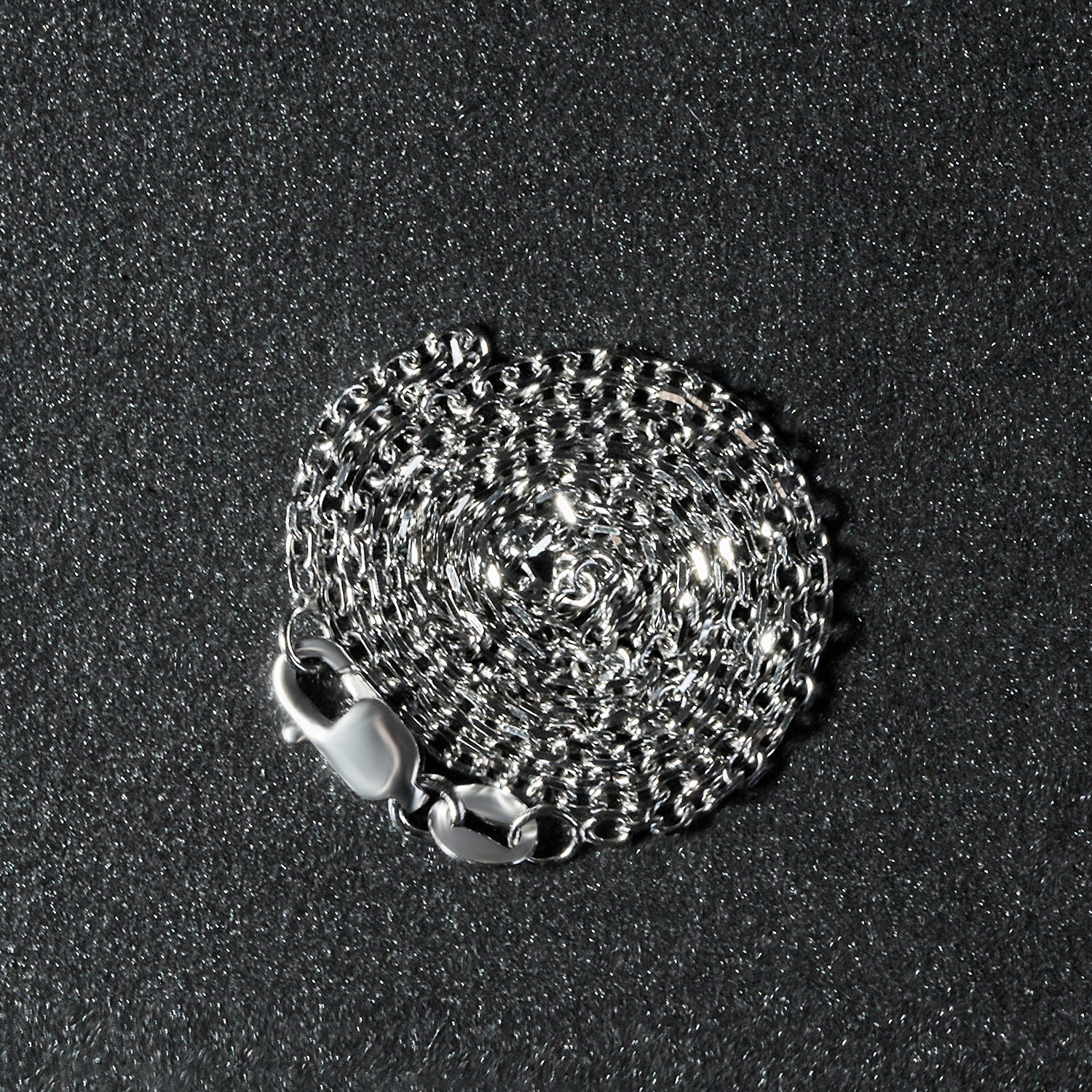 18k white gold diamond cut cable link chain with a lobster clasp.