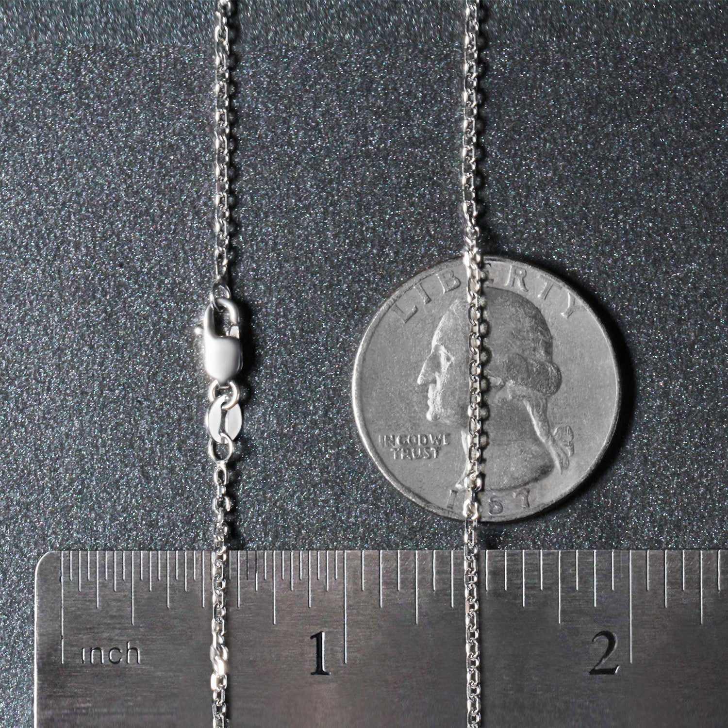 18k white gold diamond cut cable link chain with a lobster clasp, shown with a ruler and coin.