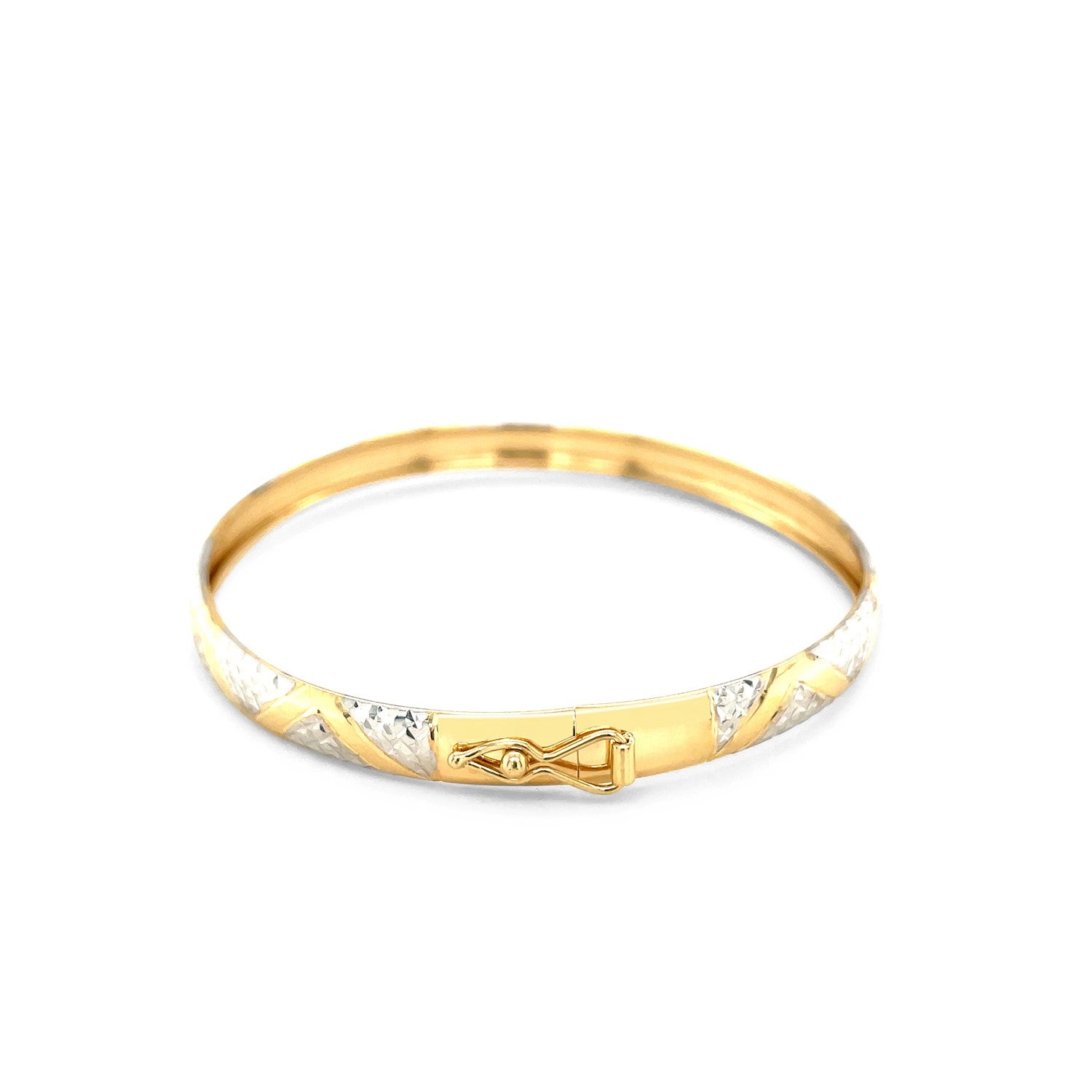 10k two-tone gold bangle with textured zigzag pattern and a secure clasp.