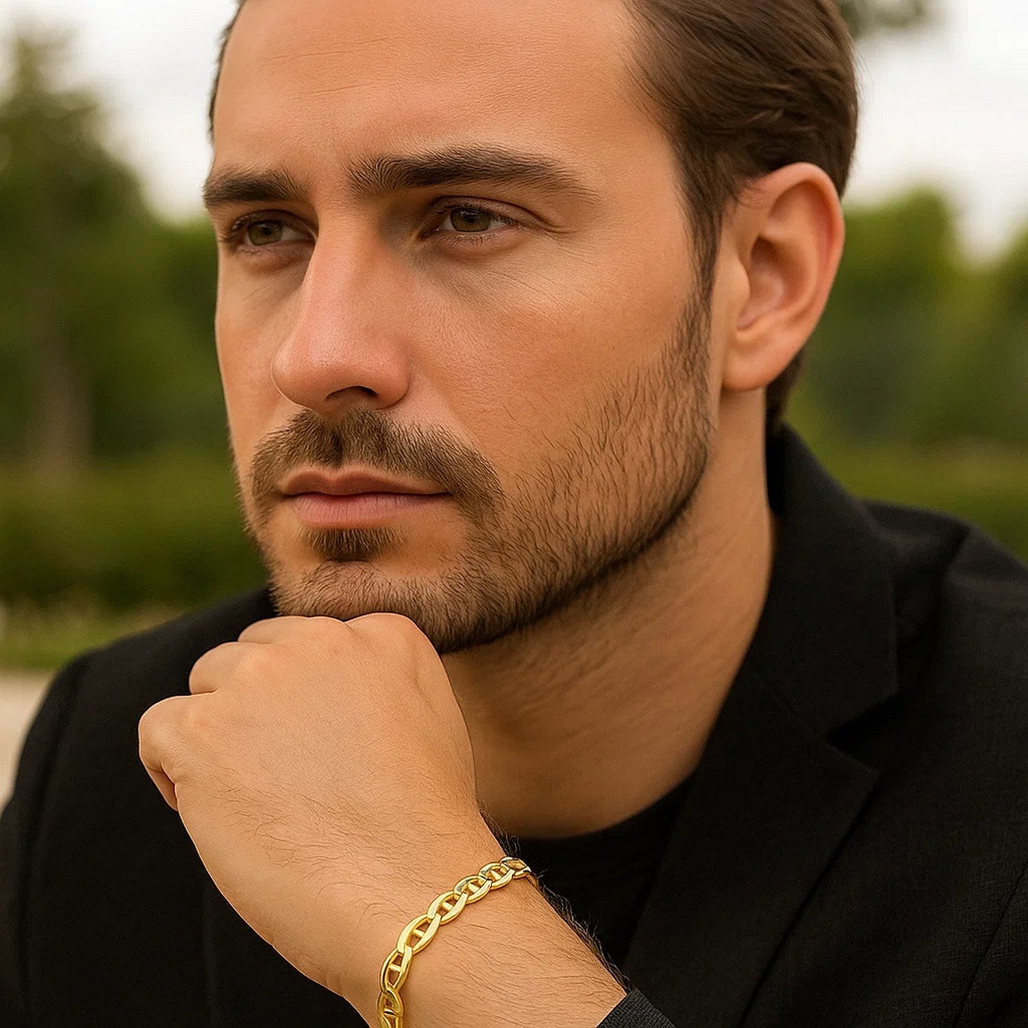10k yellow gold mariner link bracelet on a man's wrist.