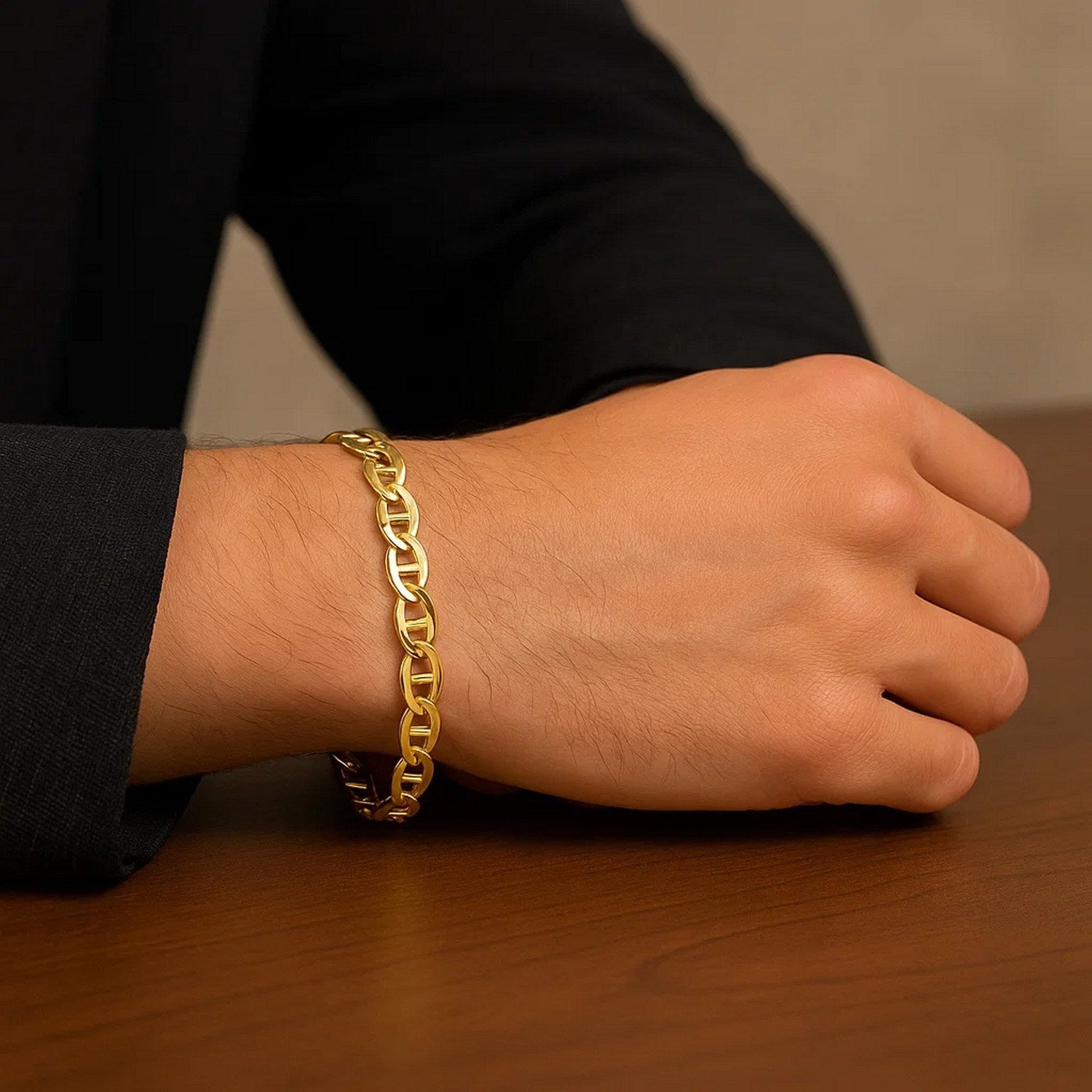 10k yellow gold mariner link bracelet on a person's wrist.