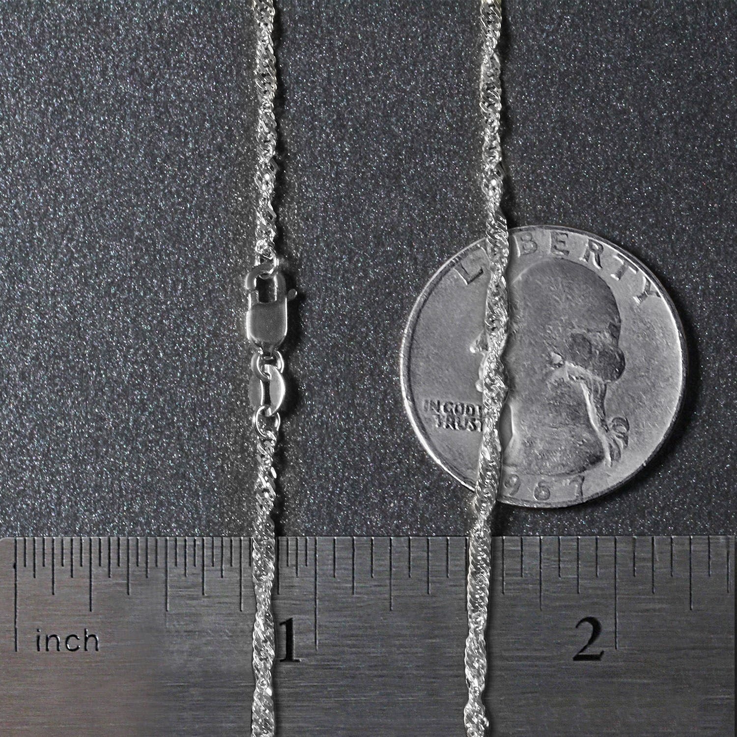 14k white gold Singapore chain with a lobster clasp, shown with a quarter and ruler for scale.