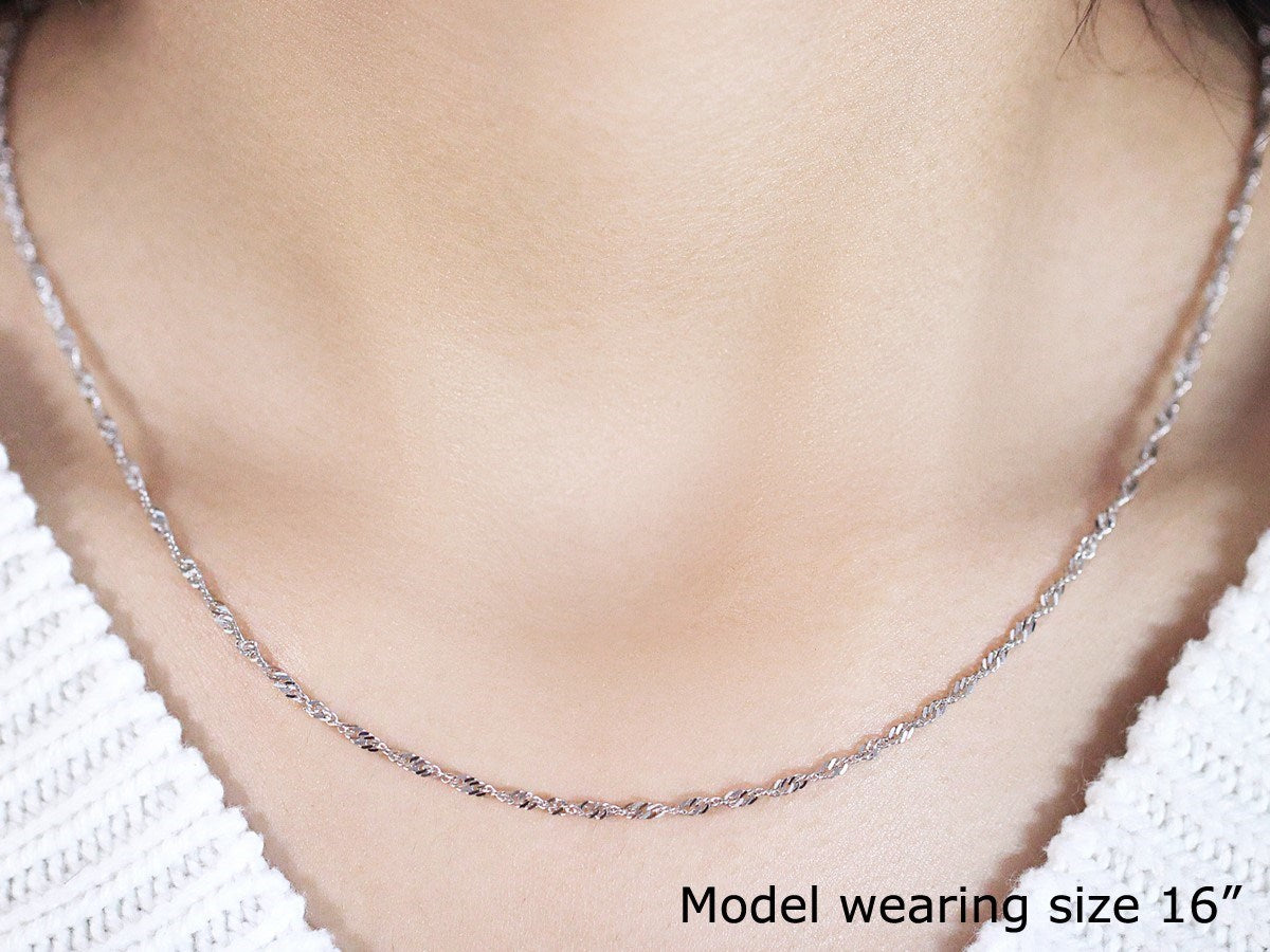 14k white gold Singapore chain, 1.80 mm wide, worn by a model.