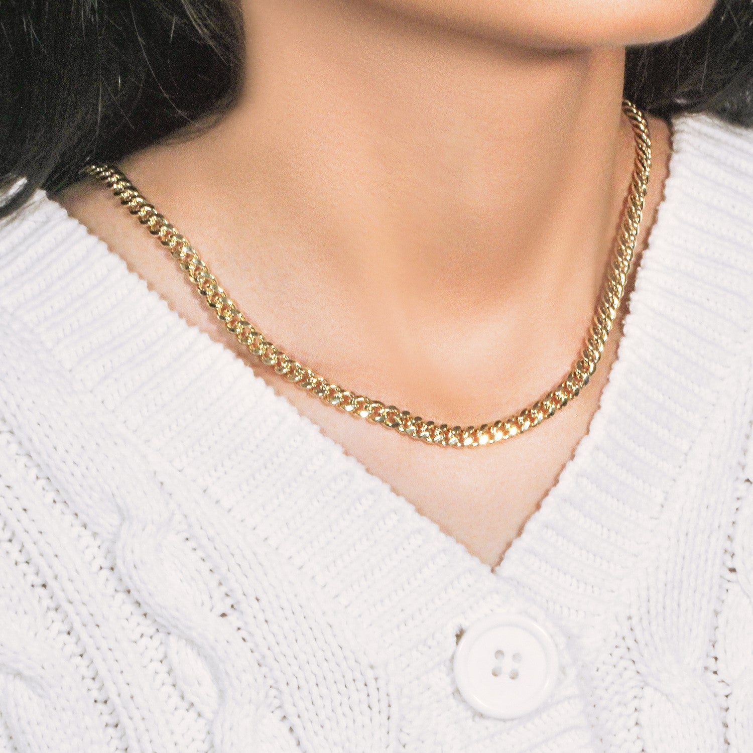 14k yellow gold semi-solid Miami Cuban chain, 5.00 mm, worn on a person.