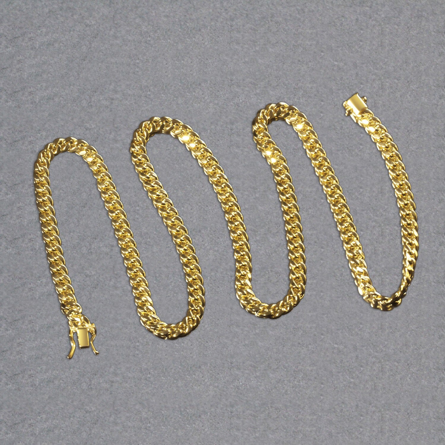A 14k yellow gold semi-solid Miami Cuban chain with a box clasp.