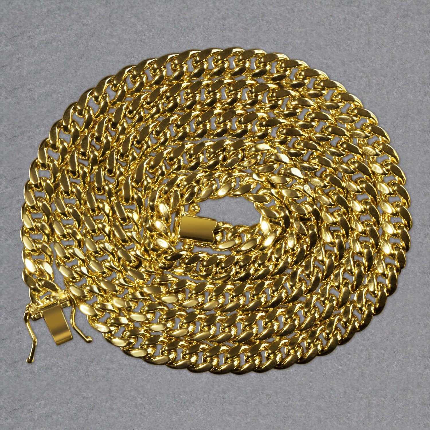 14k yellow gold semi-solid Miami Cuban chain, 5mm wide, with a box clasp.
