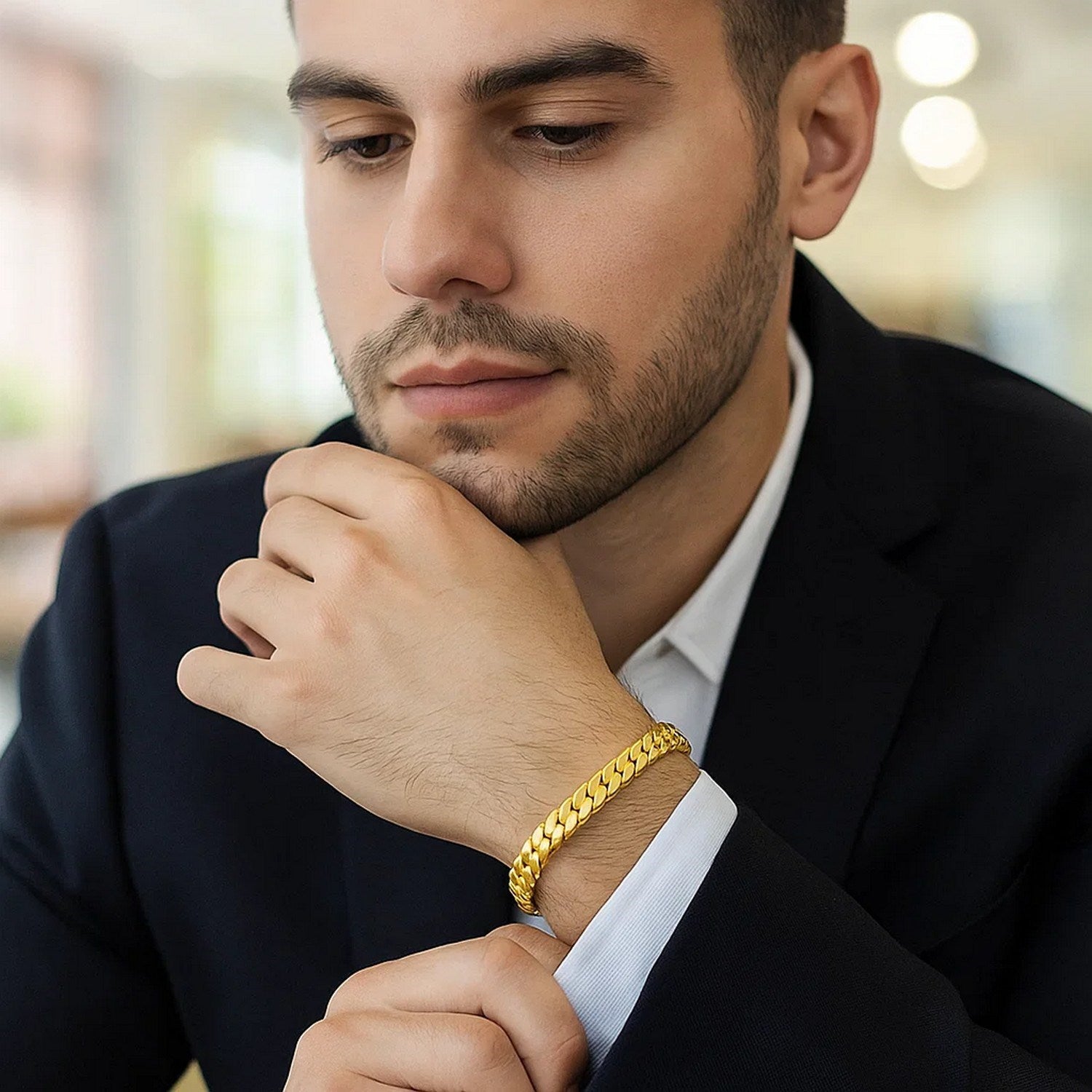 14k yellow gold 8-inch men's curb chain bracelet on a man's wrist.