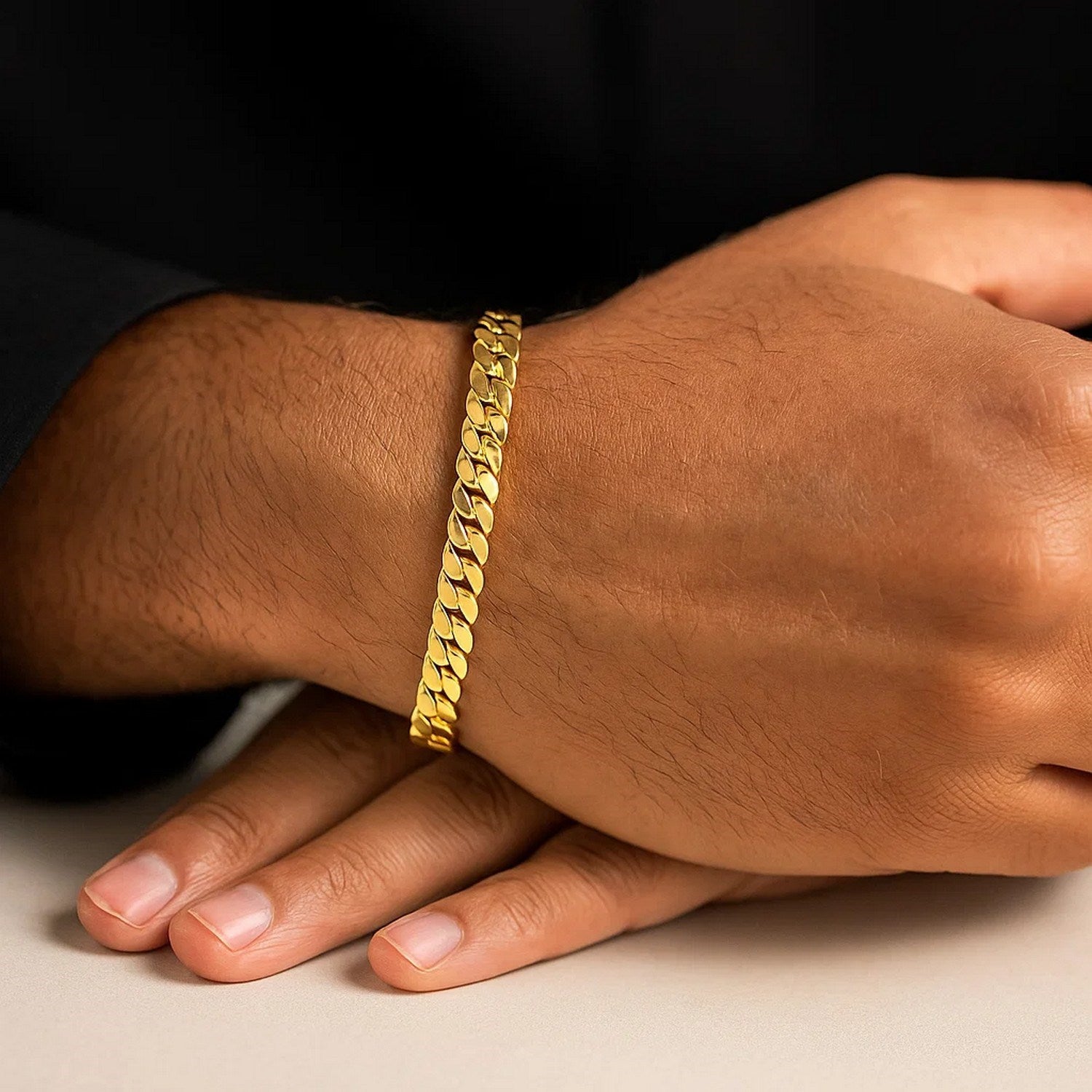 14k yellow gold 8-inch men's curb chain bracelet on a person's wrist.