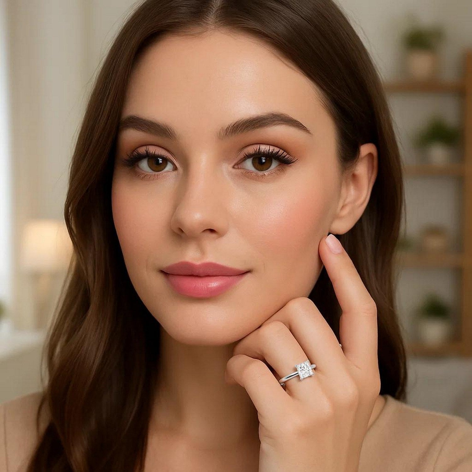 A woman wears a 2 carat princess lab grown diamond solitaire ring in 10K white gold.