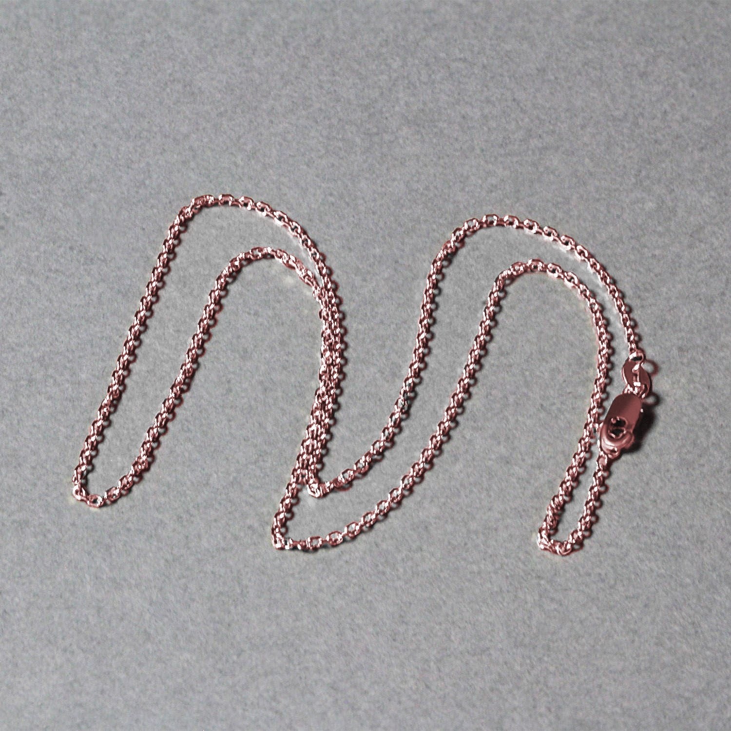 14k rose gold diamond cut cable link chain with a lobster clasp.
