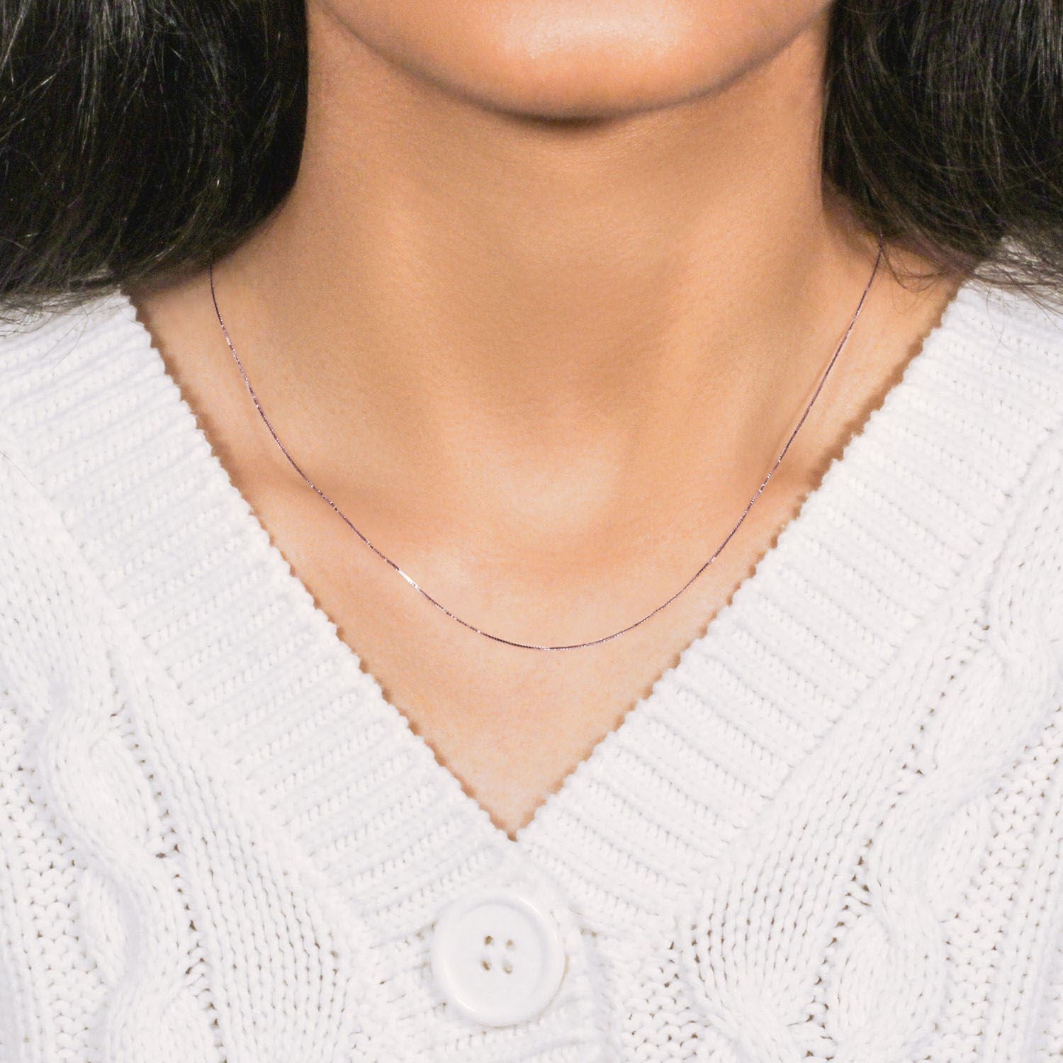 An 18k rose gold classic box chain with a width of 0.60 mm.