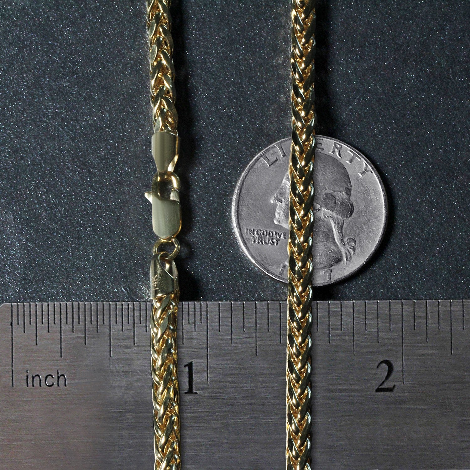 A 4.1mm 14k yellow gold diamond cut round franco chain with a lobster clasp.