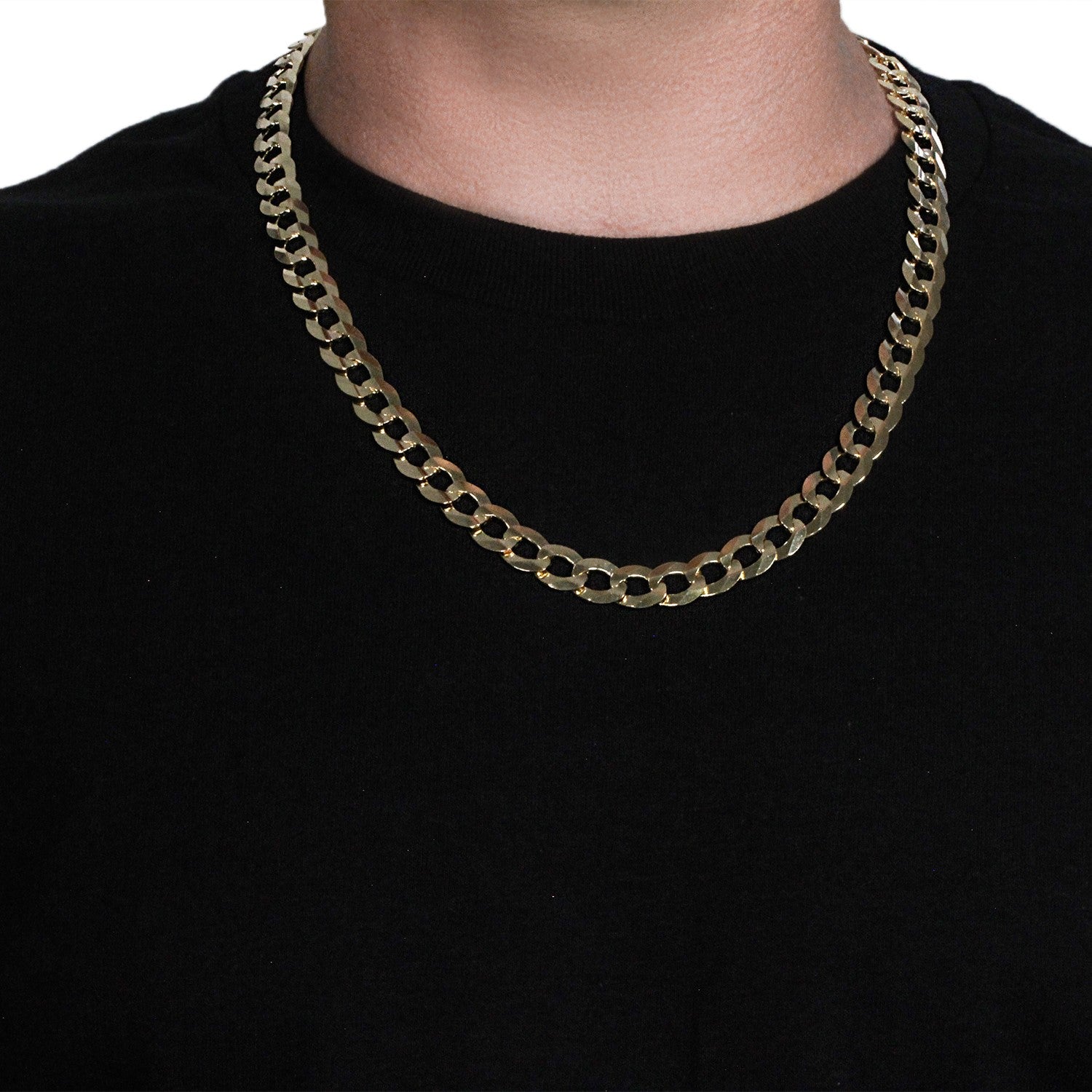 A solid 14k yellow gold curb chain, 11.23 mm wide, on a person's neck.