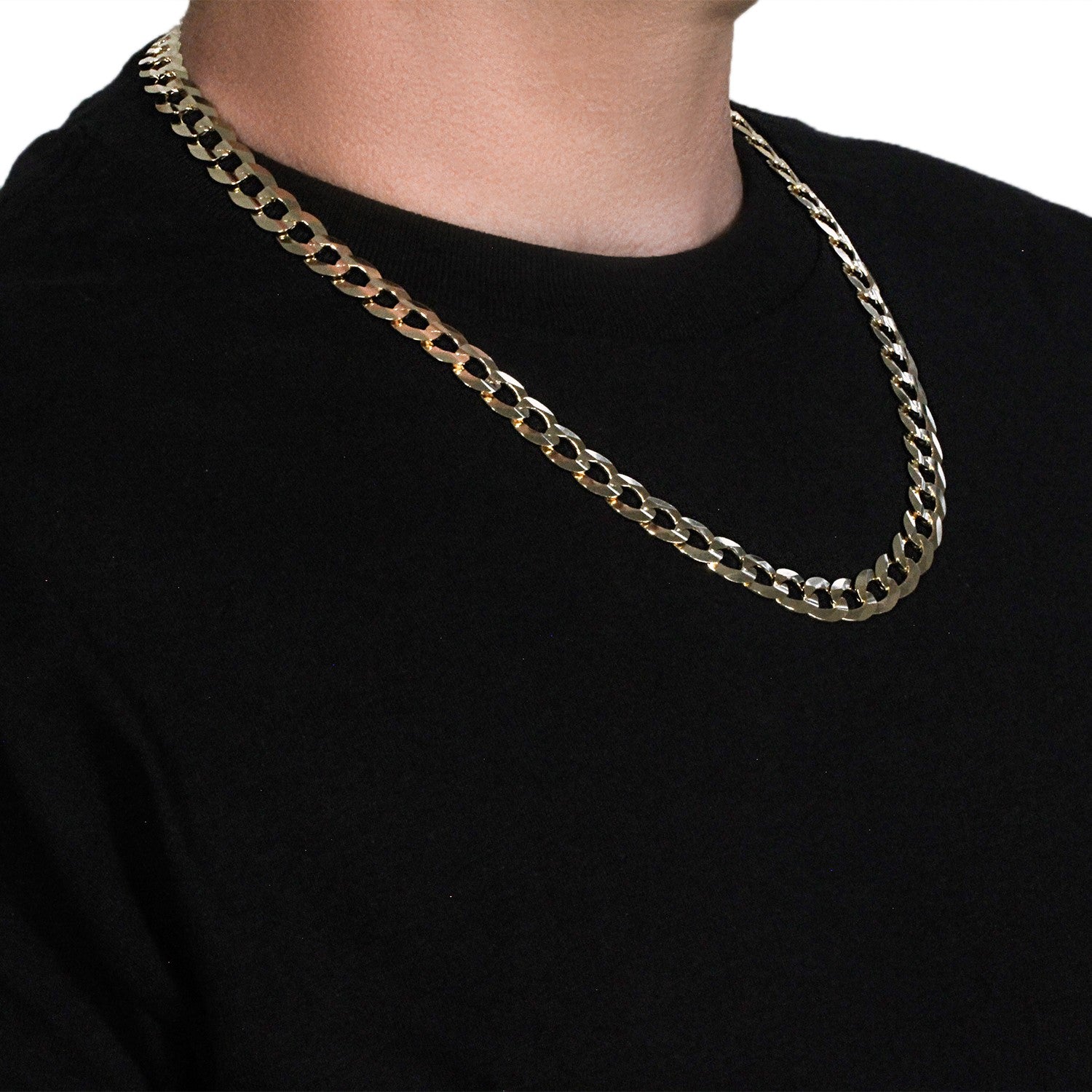 Solid 14k yellow gold curb chain, 11.23 mm wide, worn on a person.