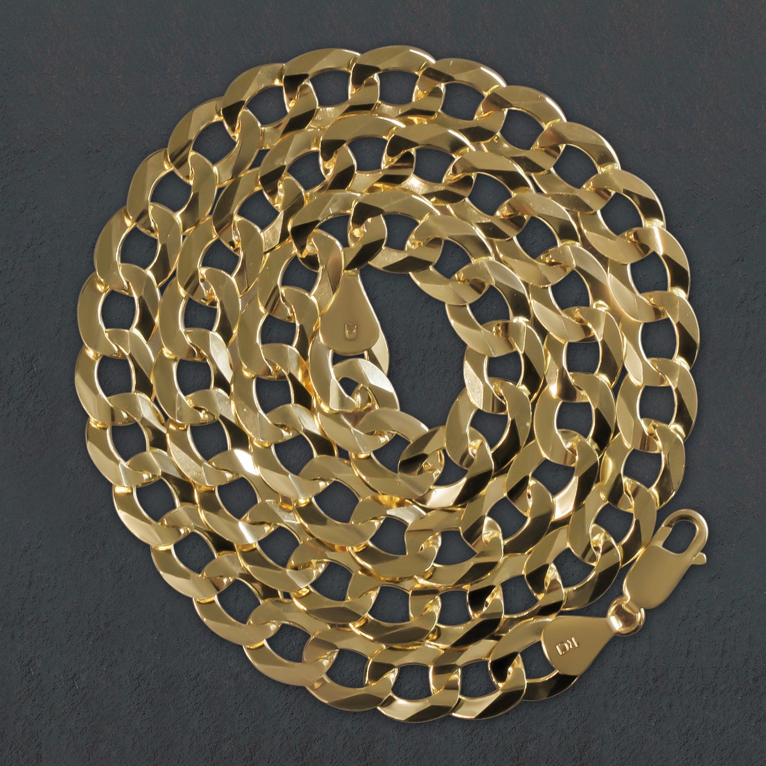 Solid 14k yellow gold curb chain, 11.23 mm wide, with a lobster clasp.