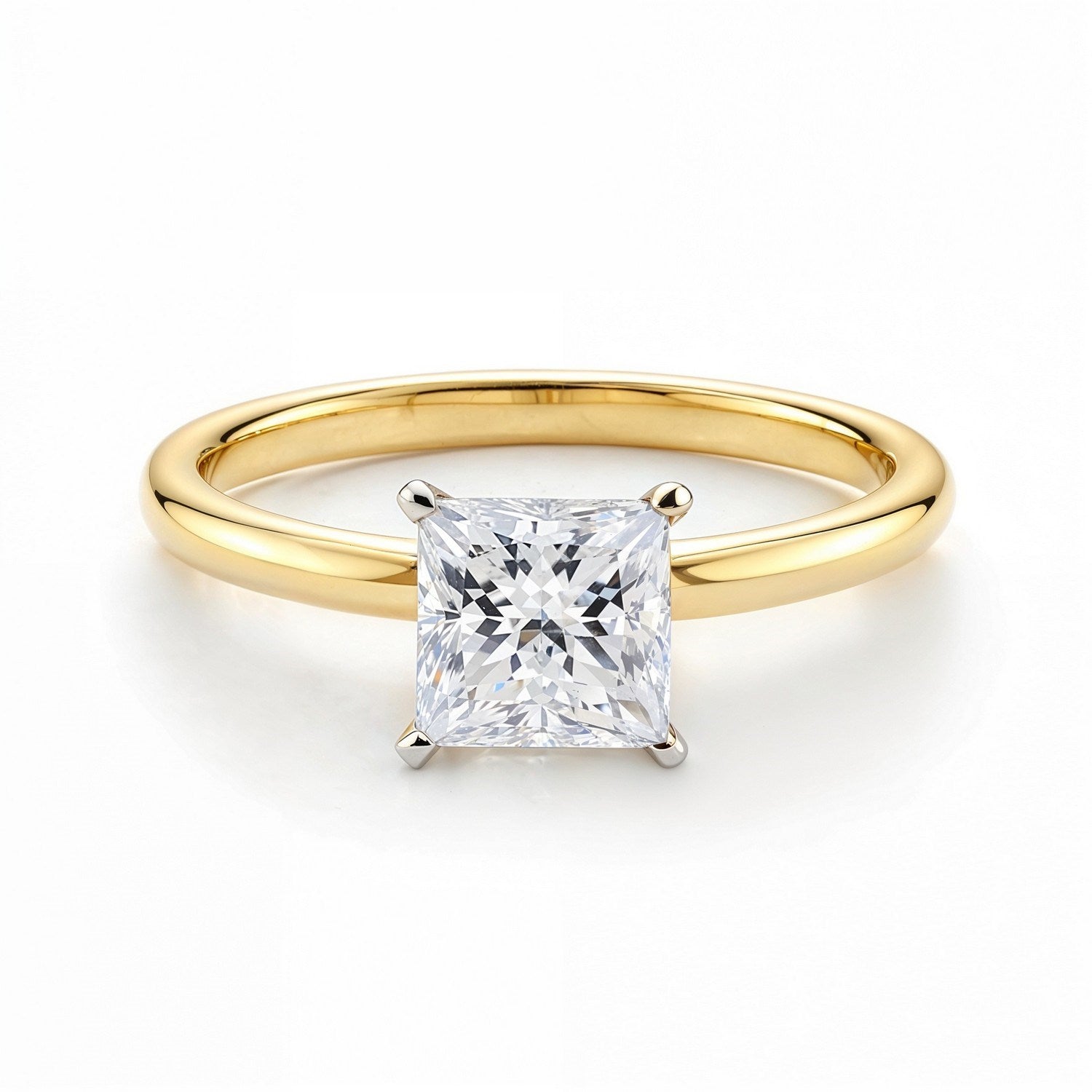 A princess-cut lab-grown diamond solitaire ring in 14K yellow gold.