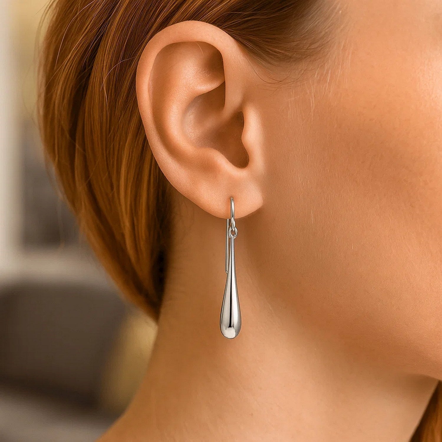 14k white gold long polished teardrop dangling earrings with french wire backings.