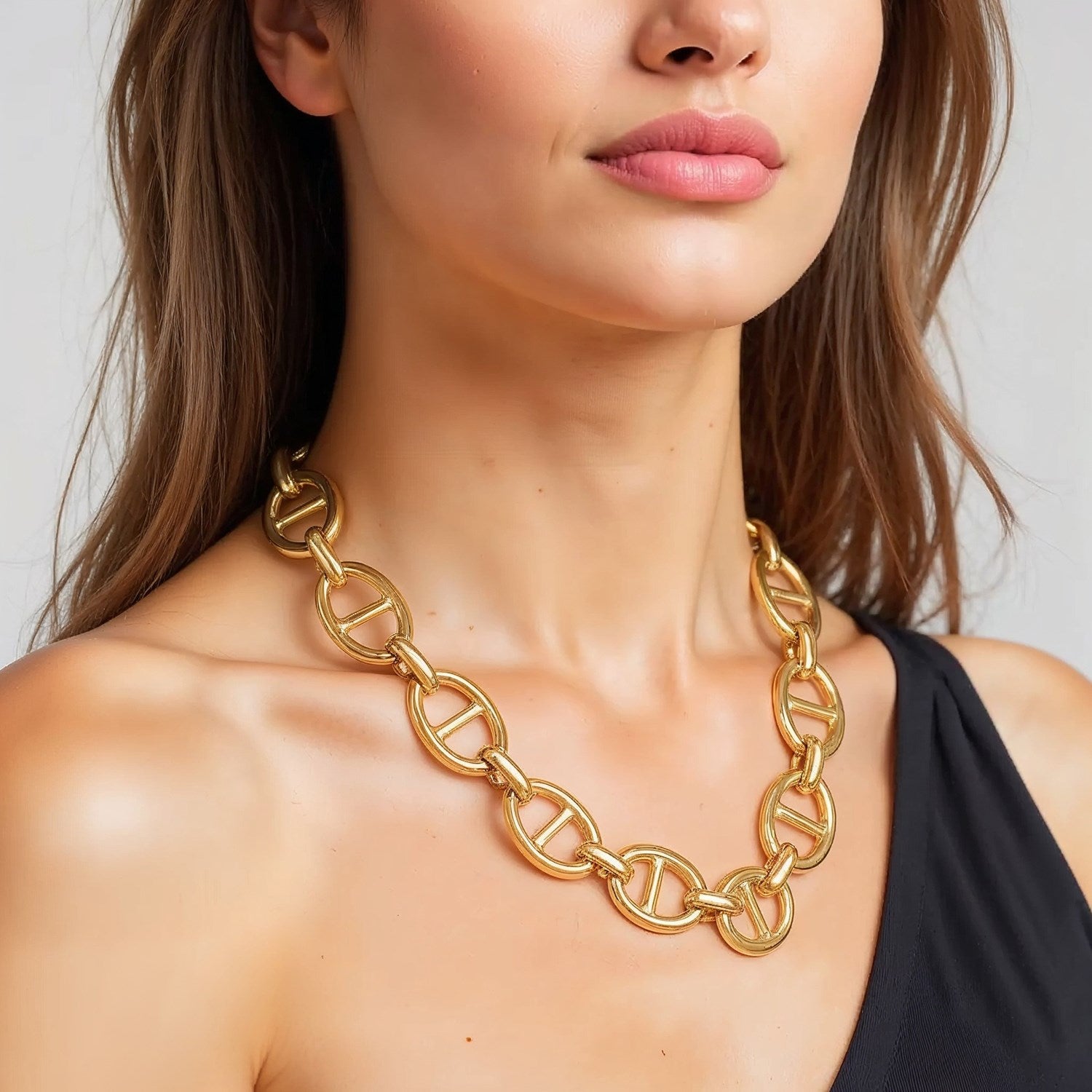14k yellow gold high polish oval mariner link necklace (13.8mm) on a woman.