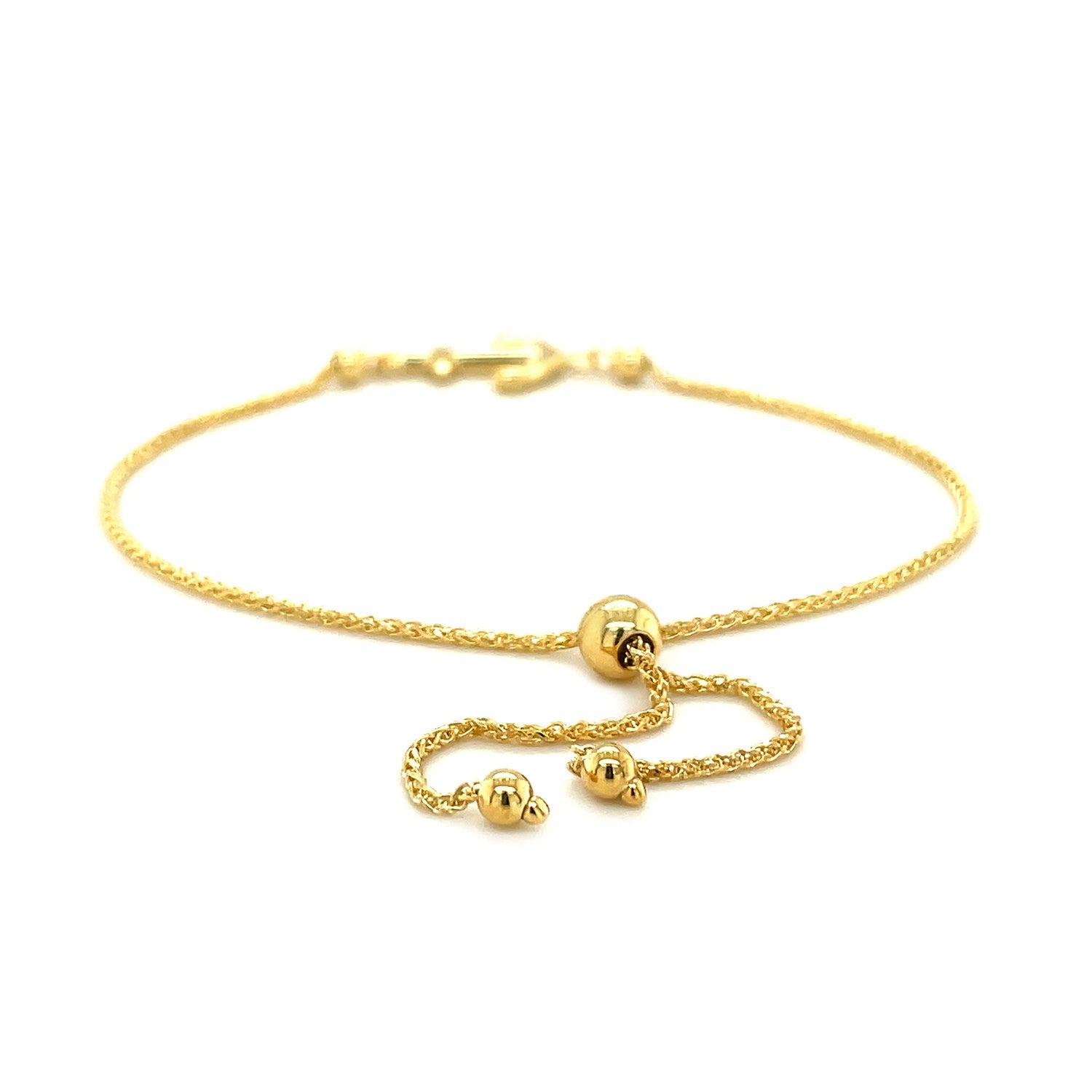 14k yellow gold anchor design adjustable lariat bracelet with a drawstring closure.