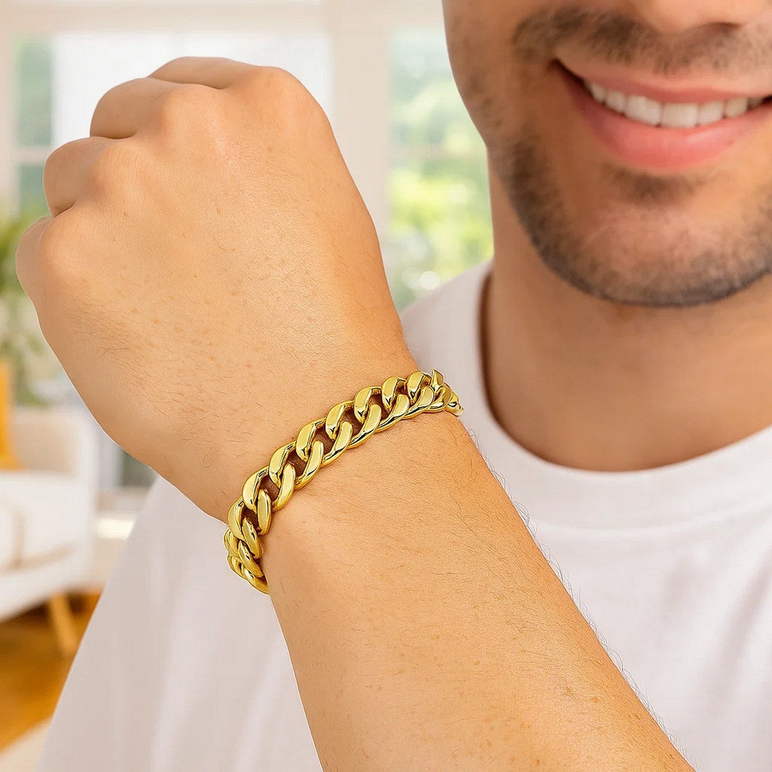 14k yellow gold polished curb chain bracelet on a man's wrist.