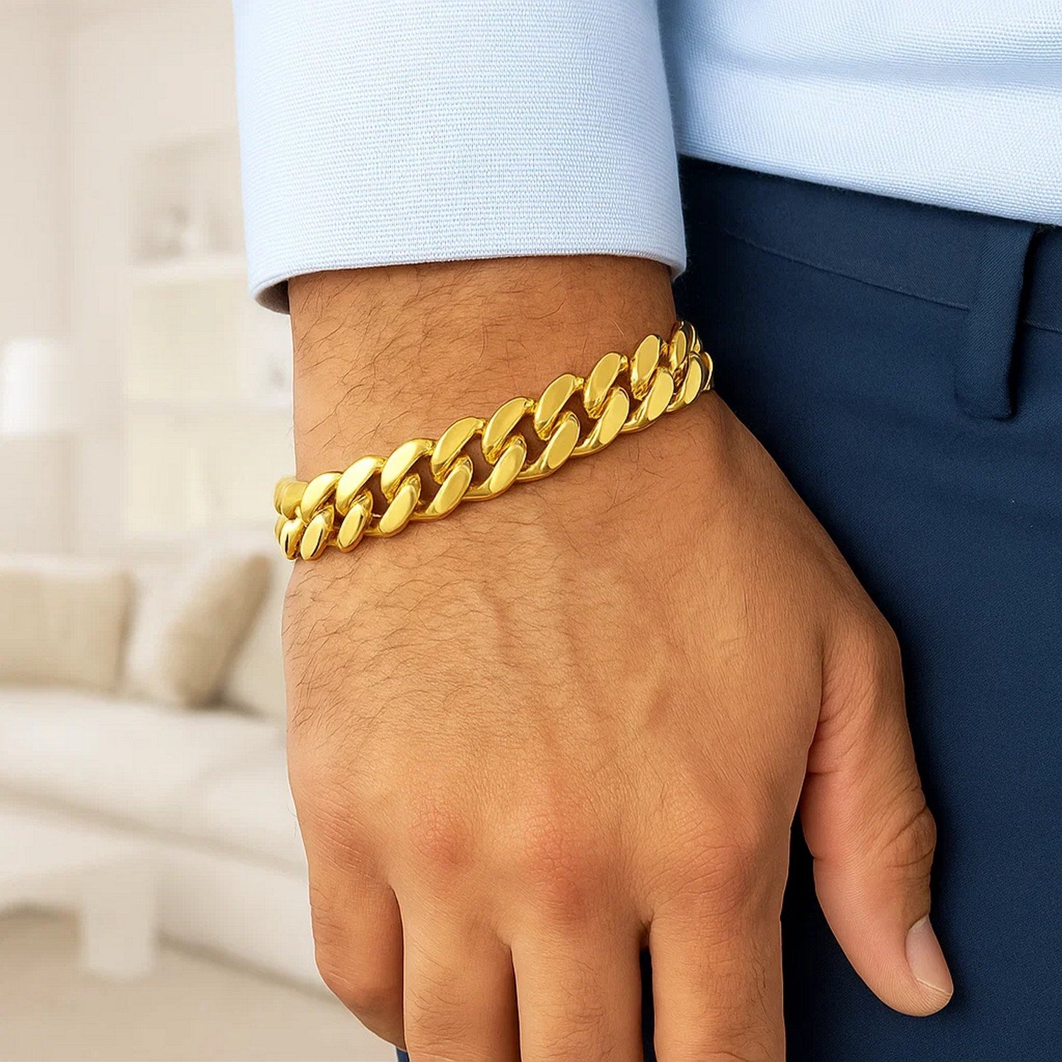 14k yellow gold polished curb chain bracelet on a person's wrist.