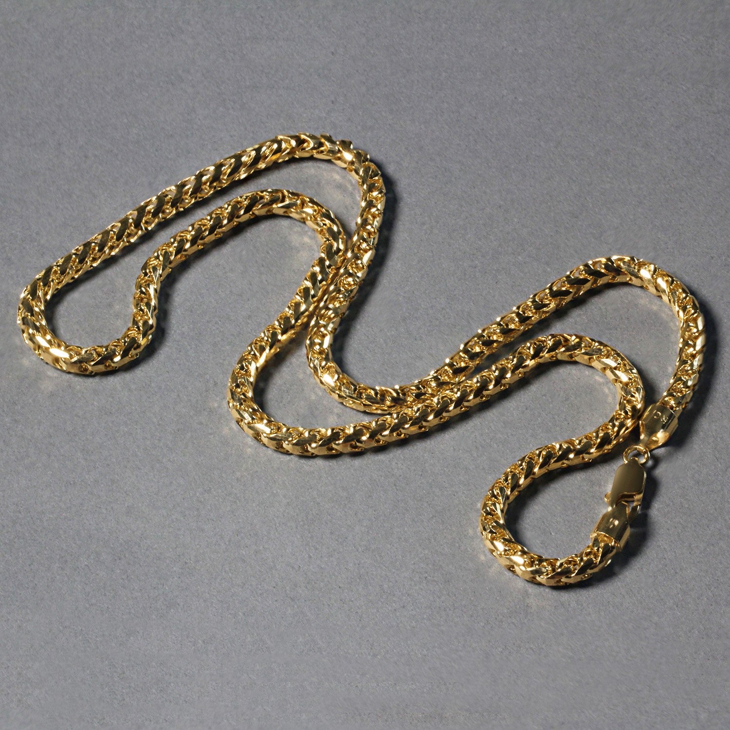 14k yellow gold diamond cut round Franco chain with a lobster clasp.