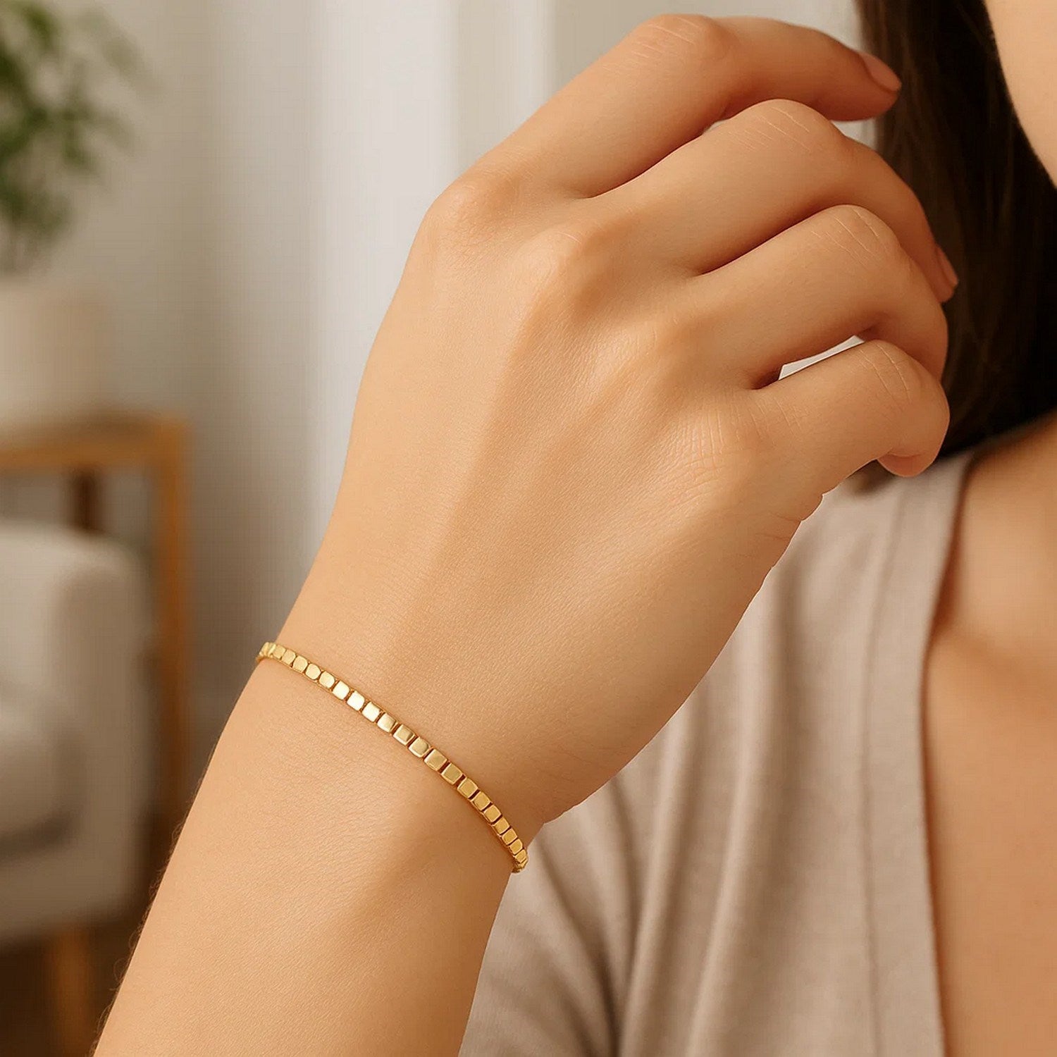 Mini Cube Bracelet in 14K Yellow Gold (2.60 mm) on a woman's wrist.