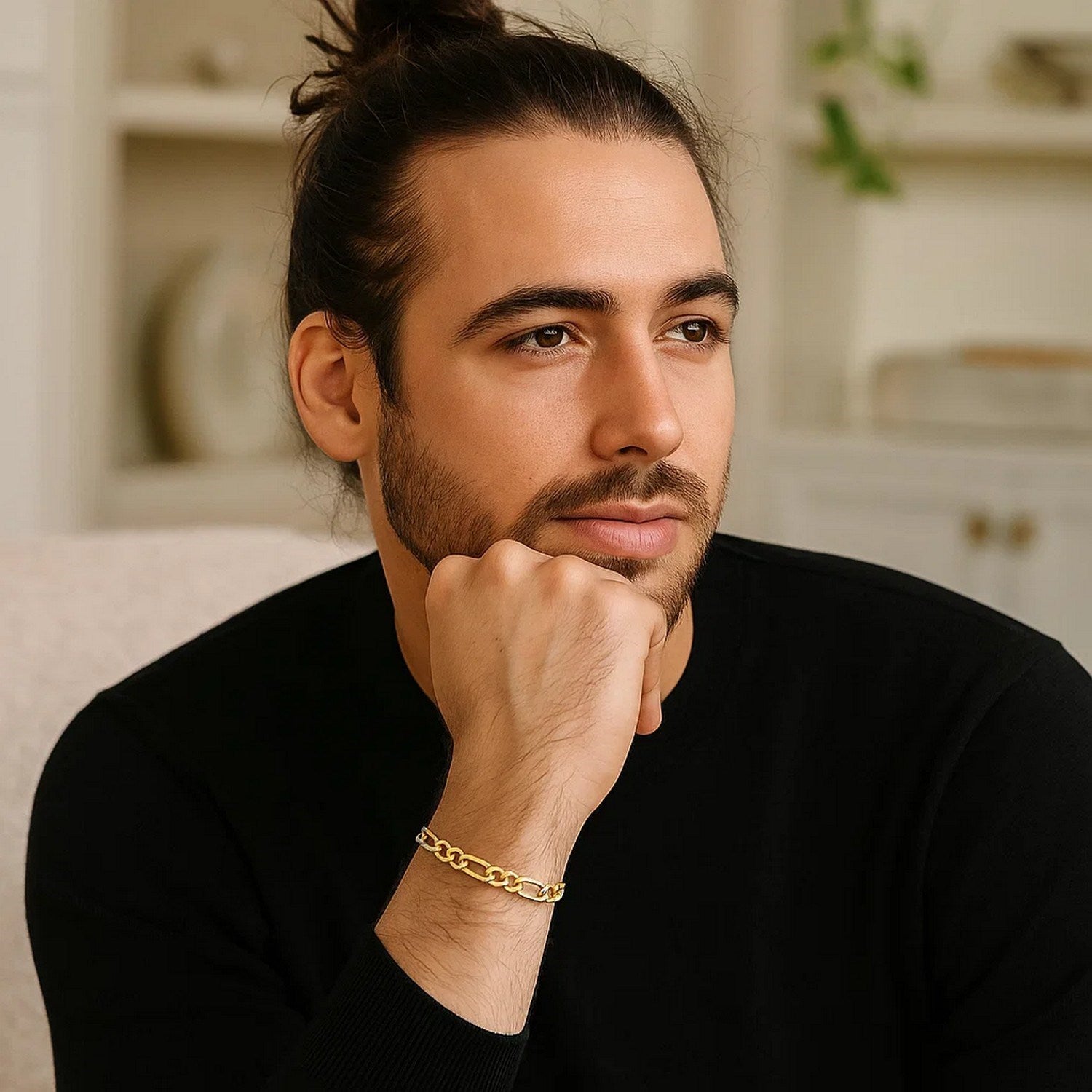 10k yellow gold Lite Figaro bracelet on a man's wrist.