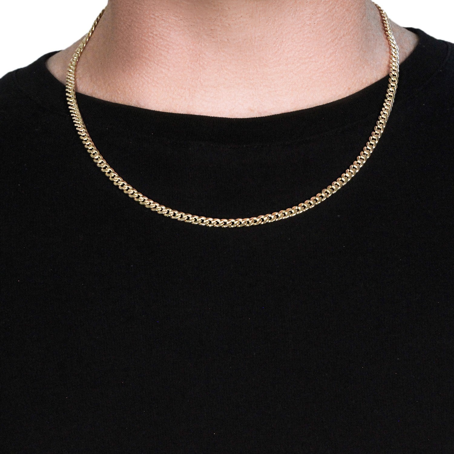 A 10k yellow gold Miami Cuban semi-solid chain, 4.5mm wide, worn around a person's neck.