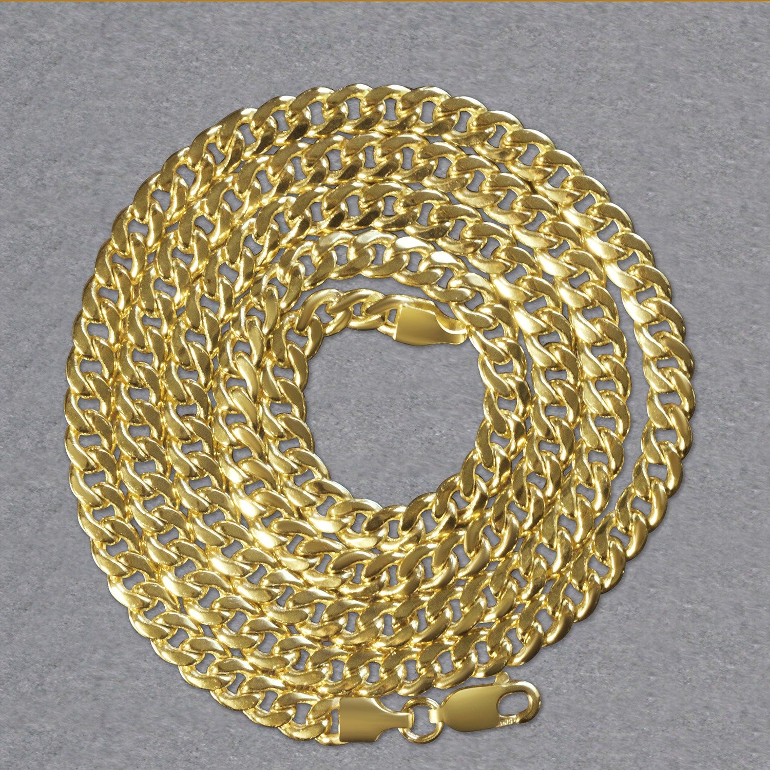 A coiled 10k yellow gold Miami Cuban semi-solid chain with a lobster clasp.