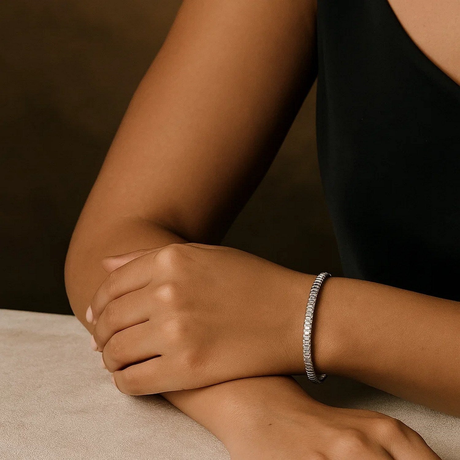 14K white gold mini diamante bracelet on a person's wrist.
