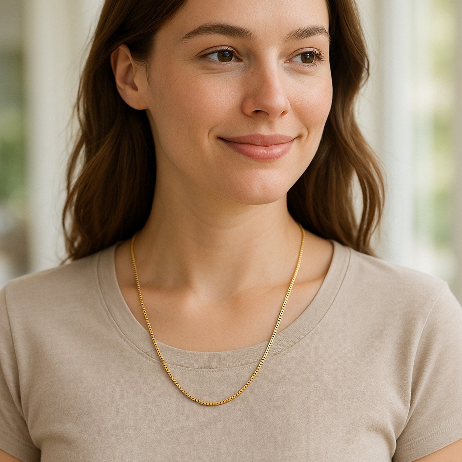 A woman wears a 10k yellow gold classic box chain.