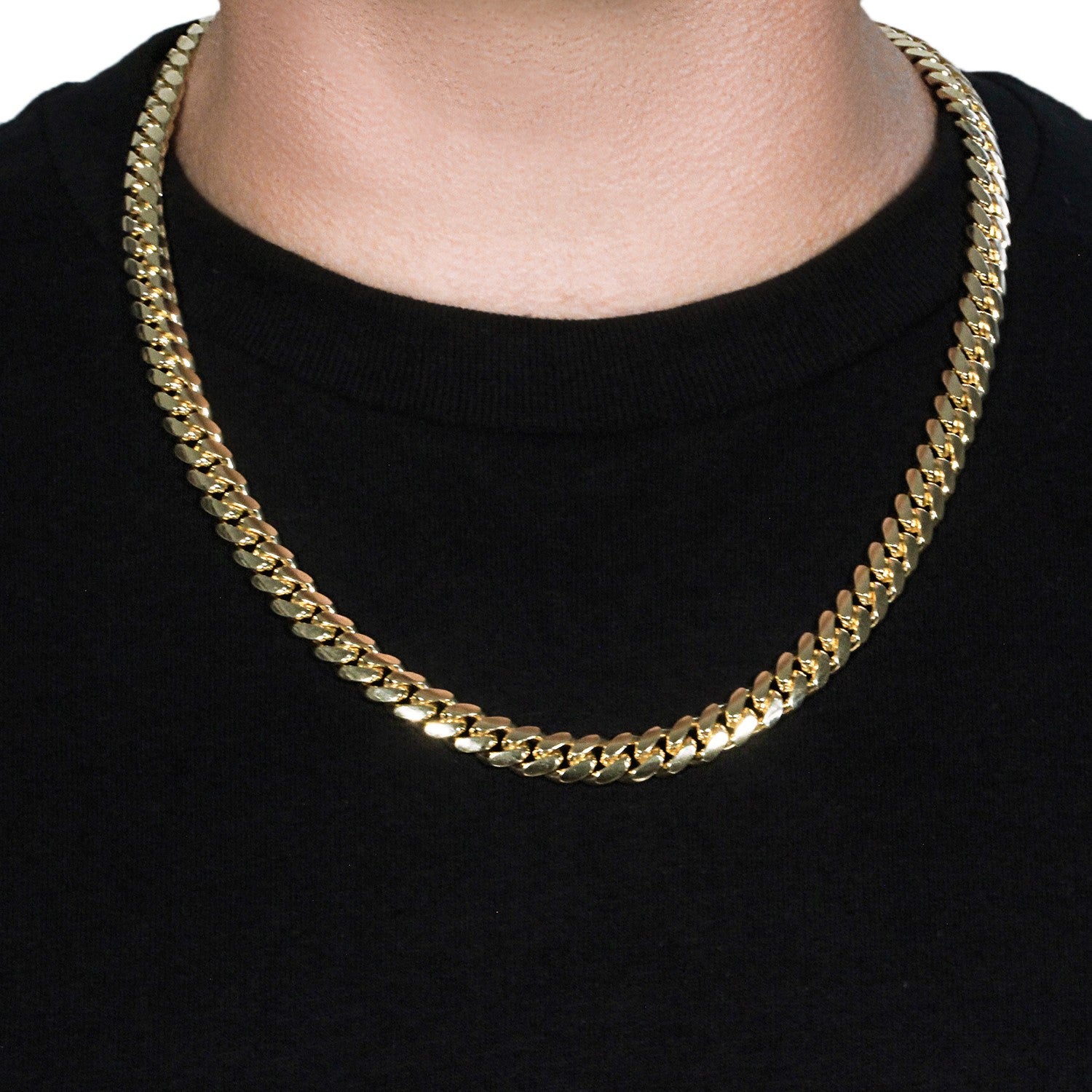 A 14k yellow gold classic Miami Cuban solid chain, 9.20 mm wide, on a person.