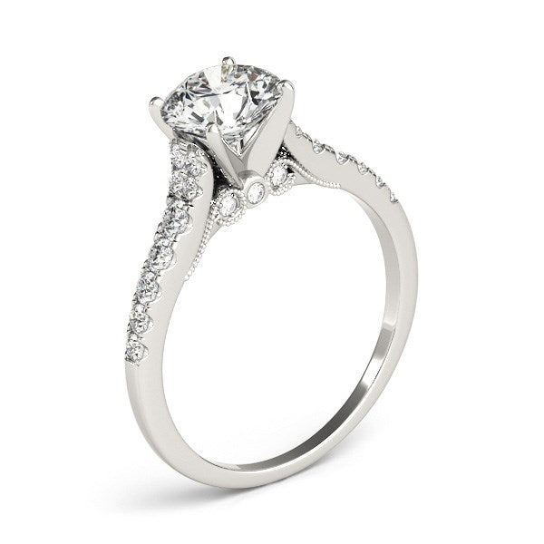 14k white gold diamond engagement ring with a single row band and a round center stone.