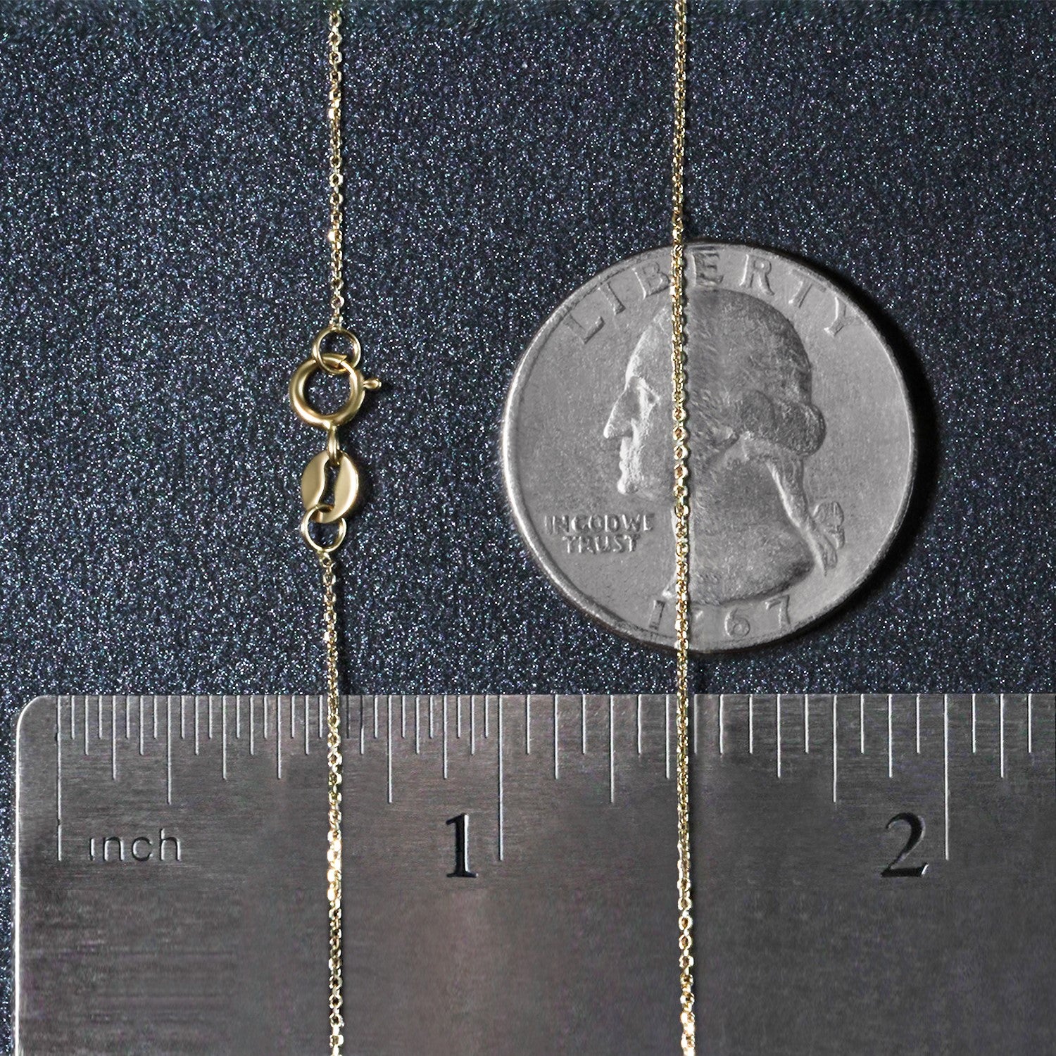 A 14k yellow gold diamond cut cable link chain with a spring ring clasp.