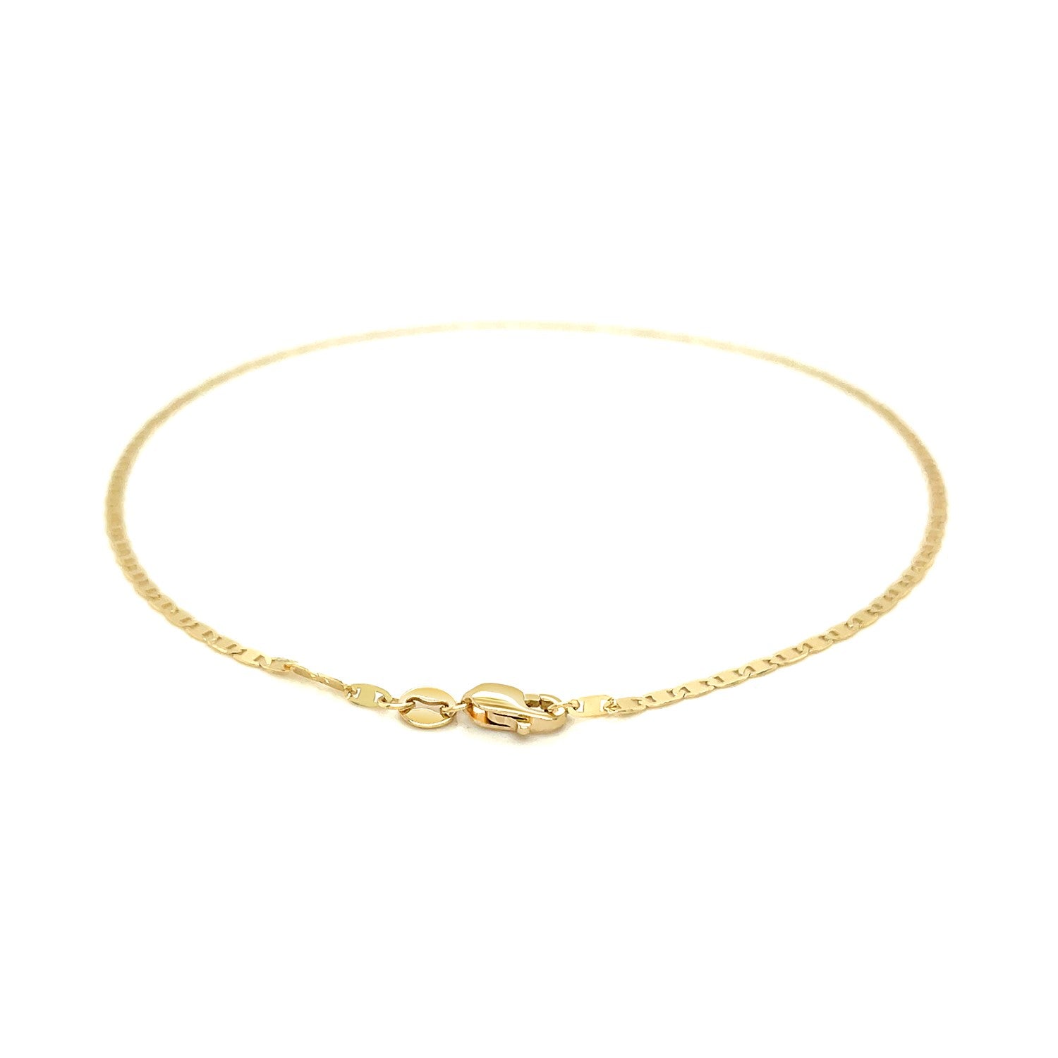 A 14k yellow gold mariner link anklet with a lobster clasp.