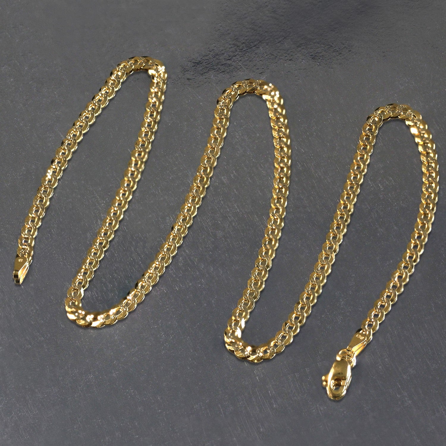 A 14k two-tone gold pave curb chain, 3.60 mm wide, with a lobster clasp.