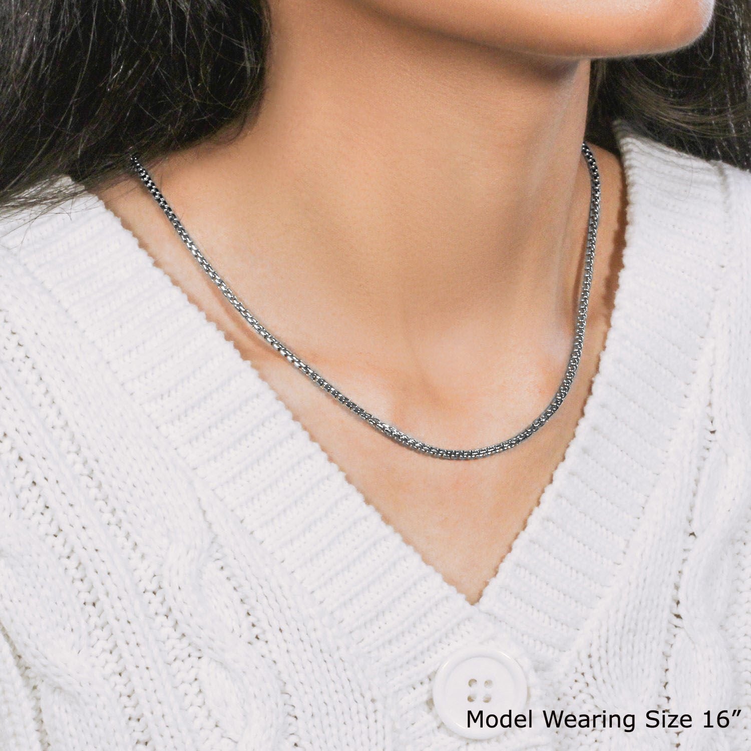 A woman wears a 14k white gold solid round box chain.