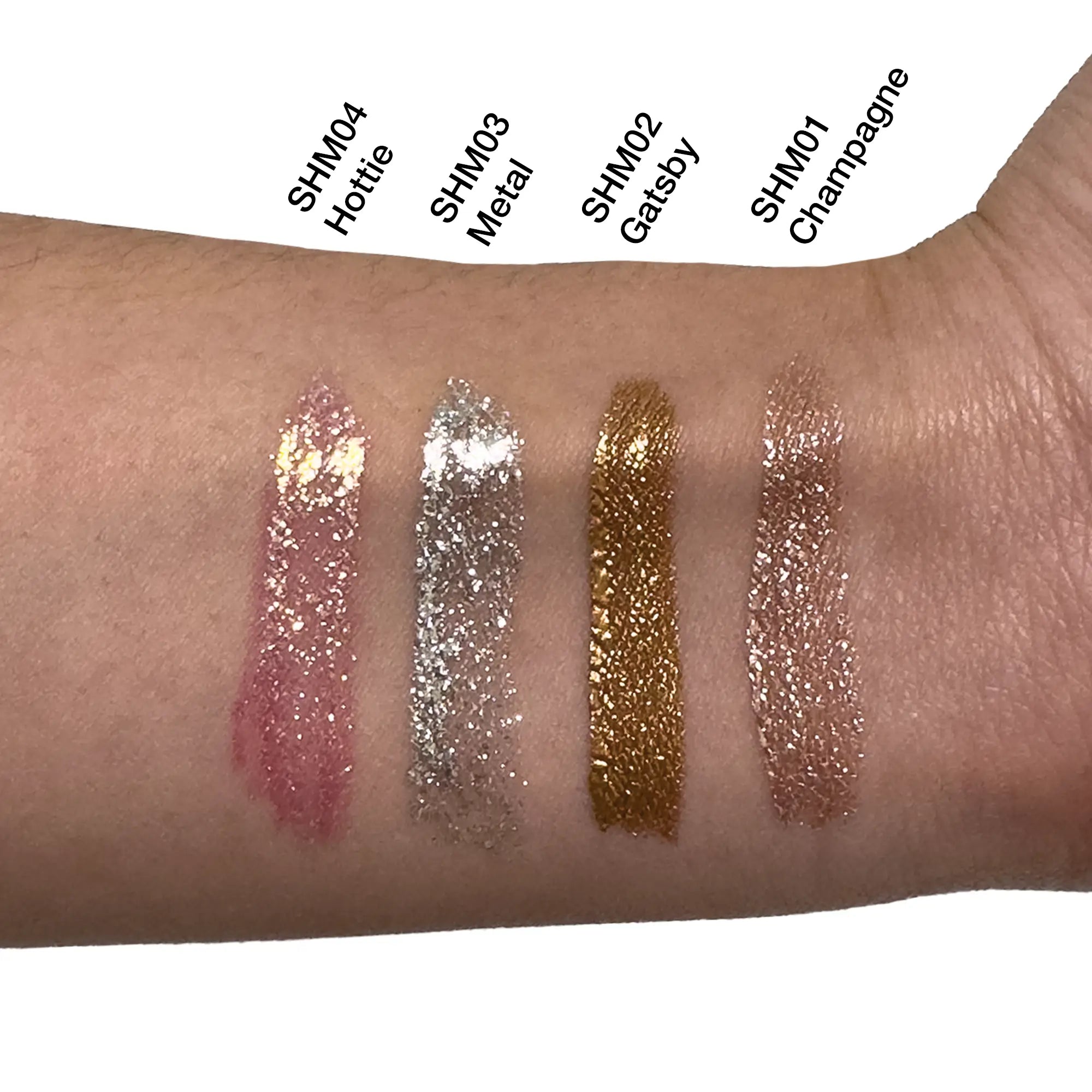 Four swatches of glitter liquid shimmer are shown on an arm.