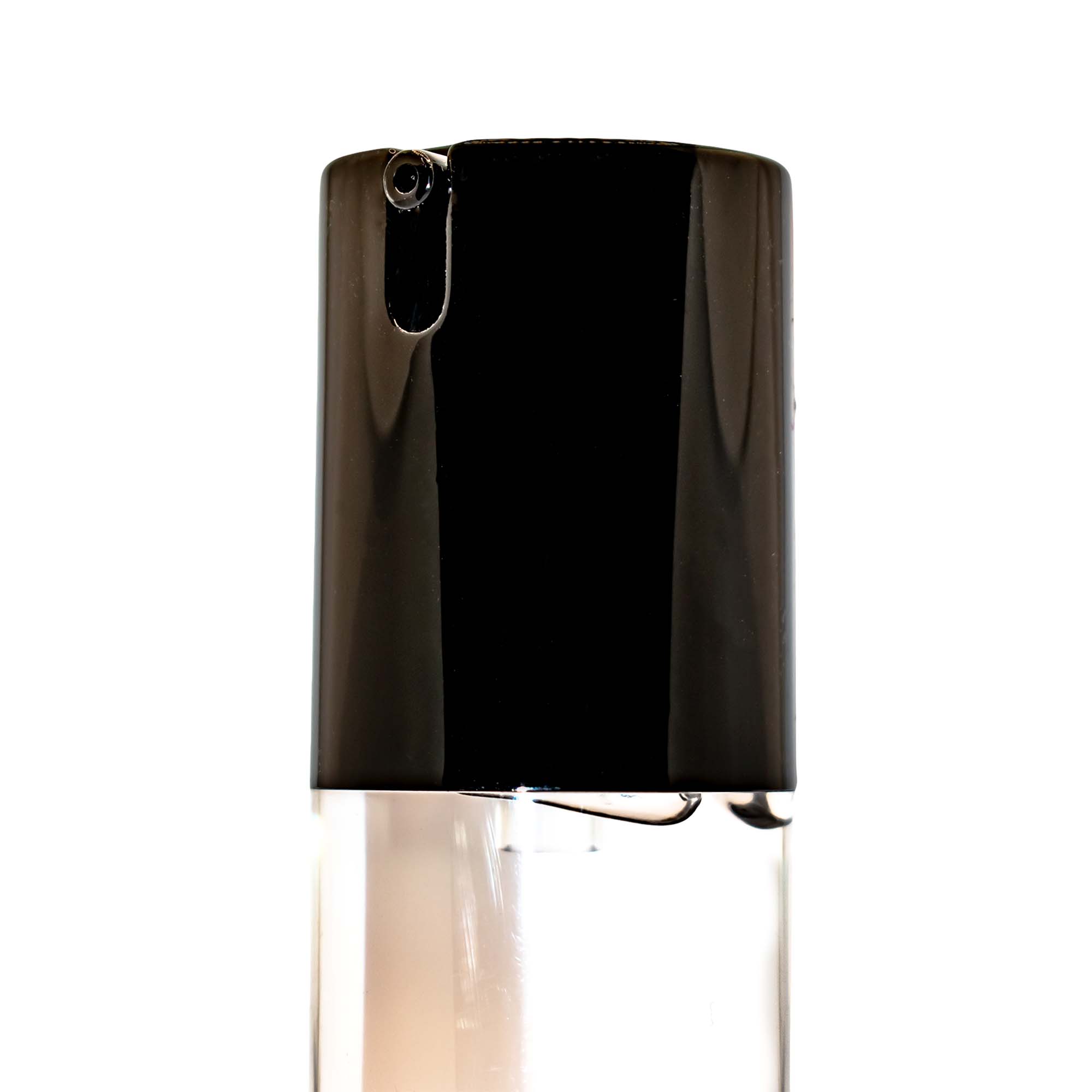 A clear bottle of mattifying face primer with a black pump dispenser.