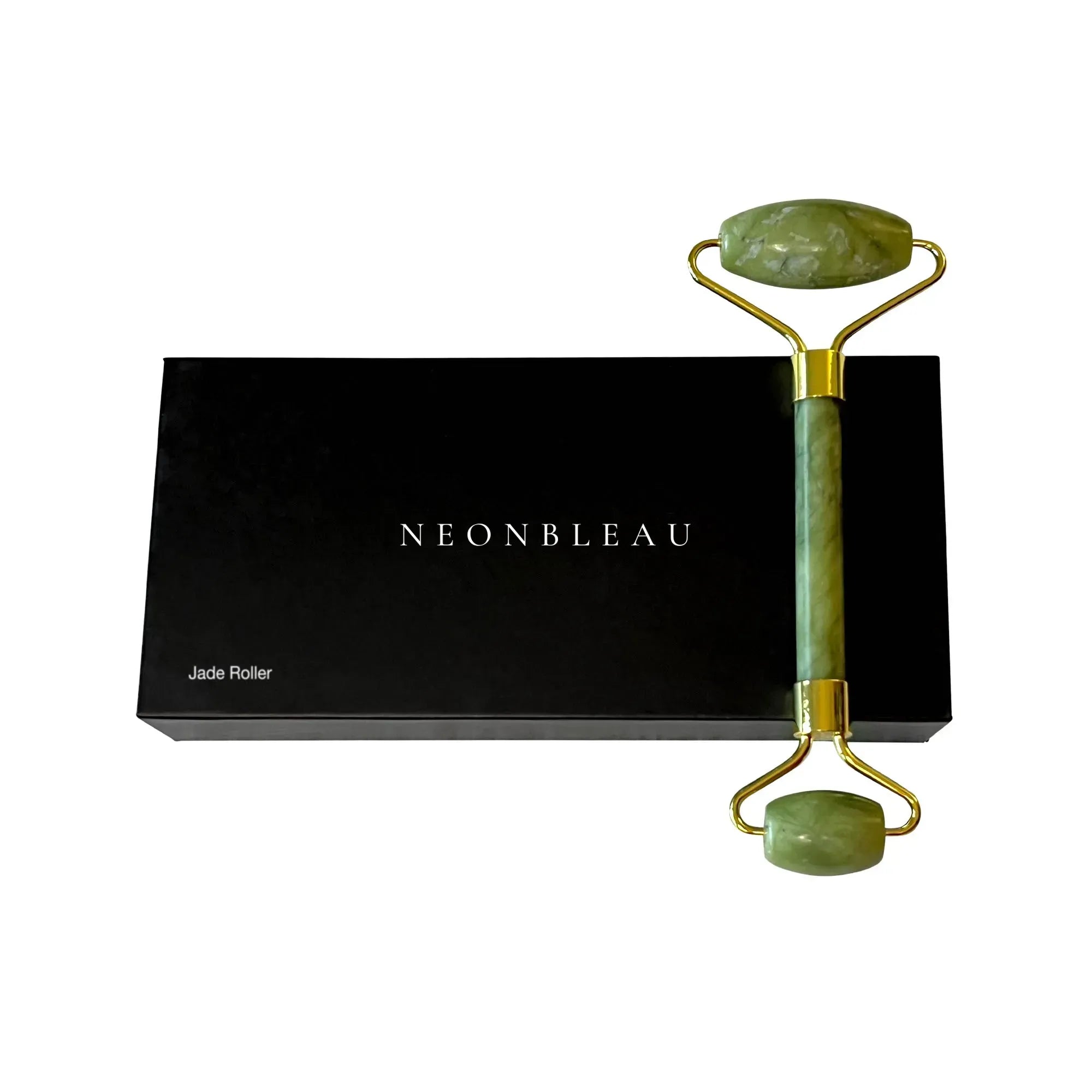 A jade roller with gold-colored metal accents rests on a black box labeled "NEONBLEAU Jade Roller."