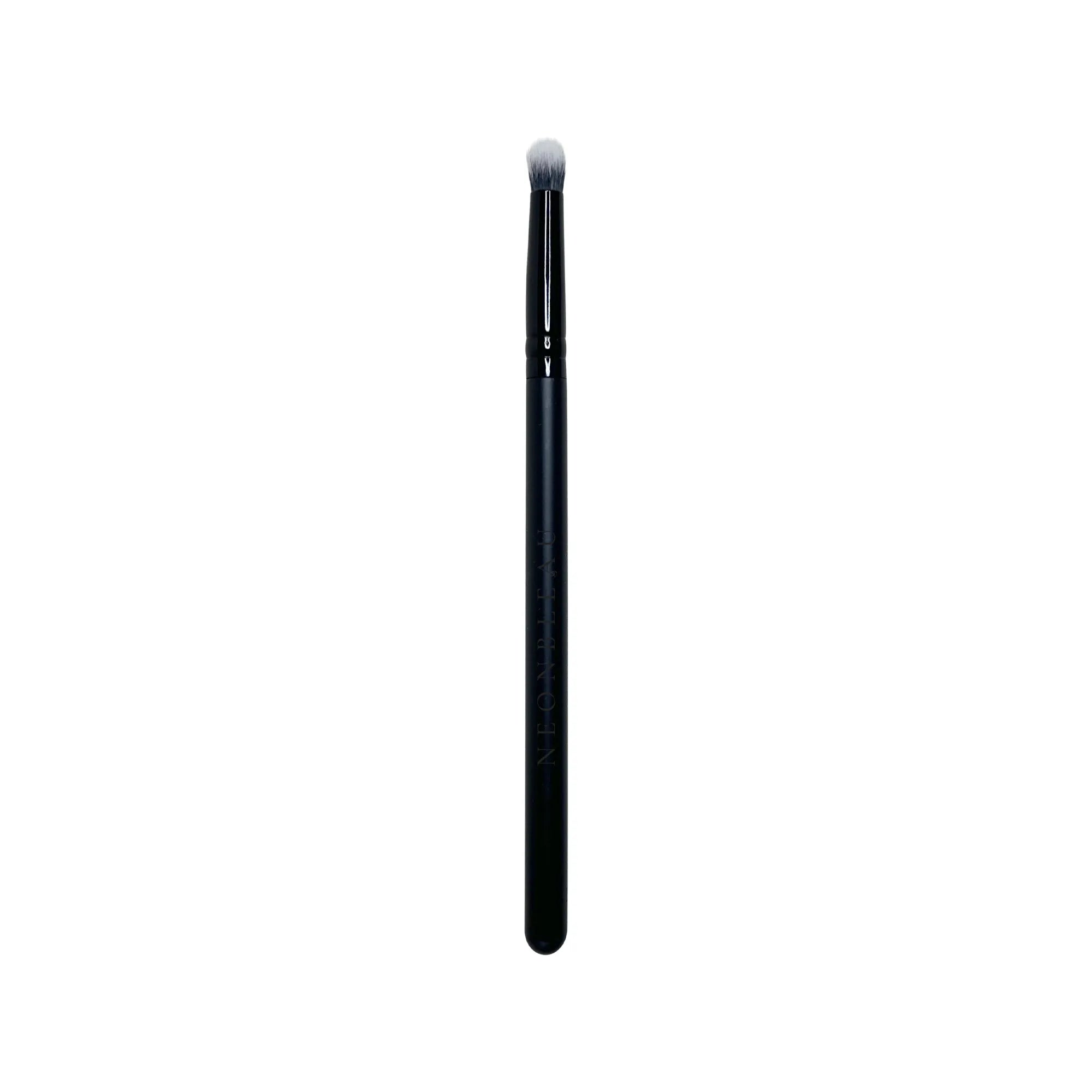 A black mini crease brush with soft, white and grey bristles.
