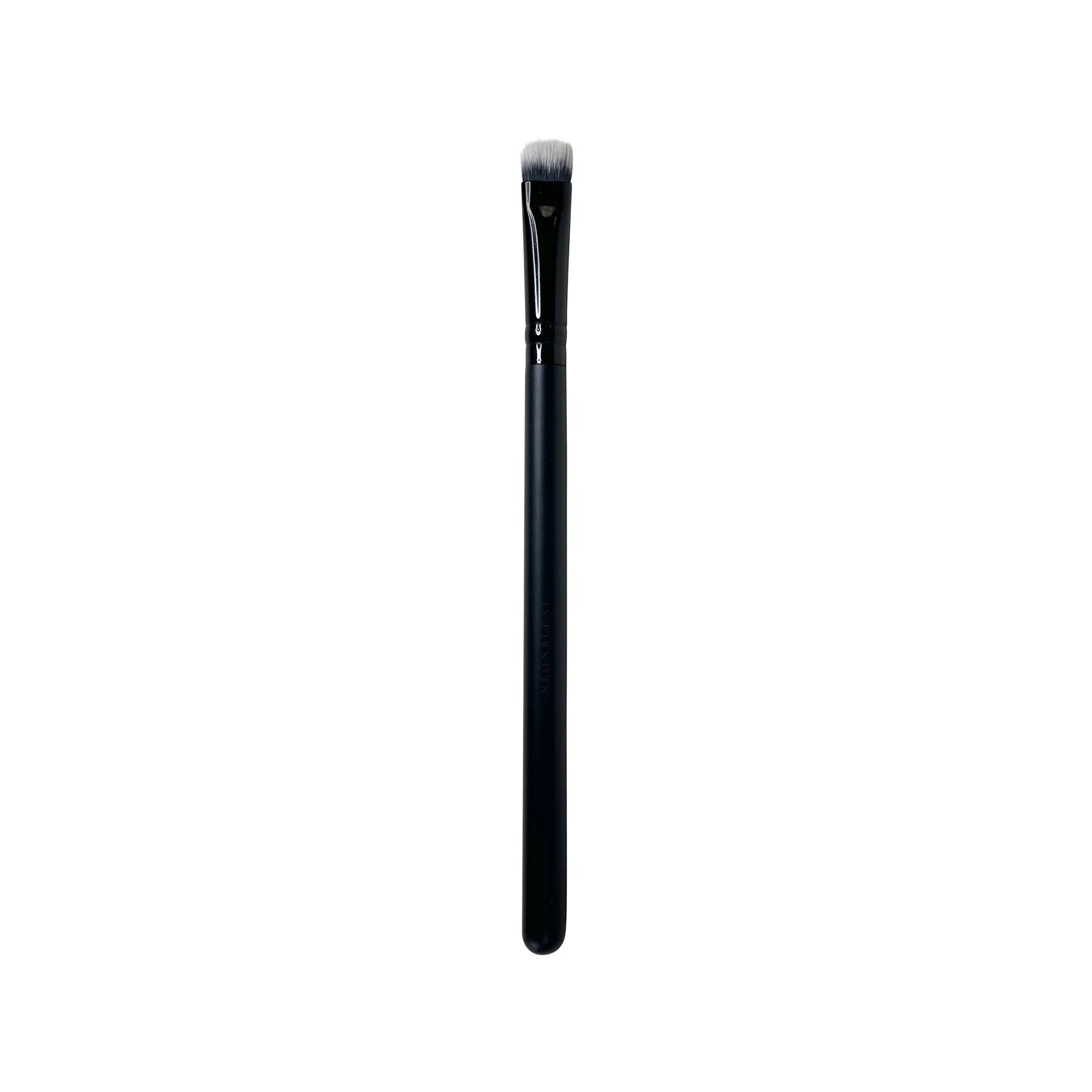 A black packing eye brush with white bristles.
