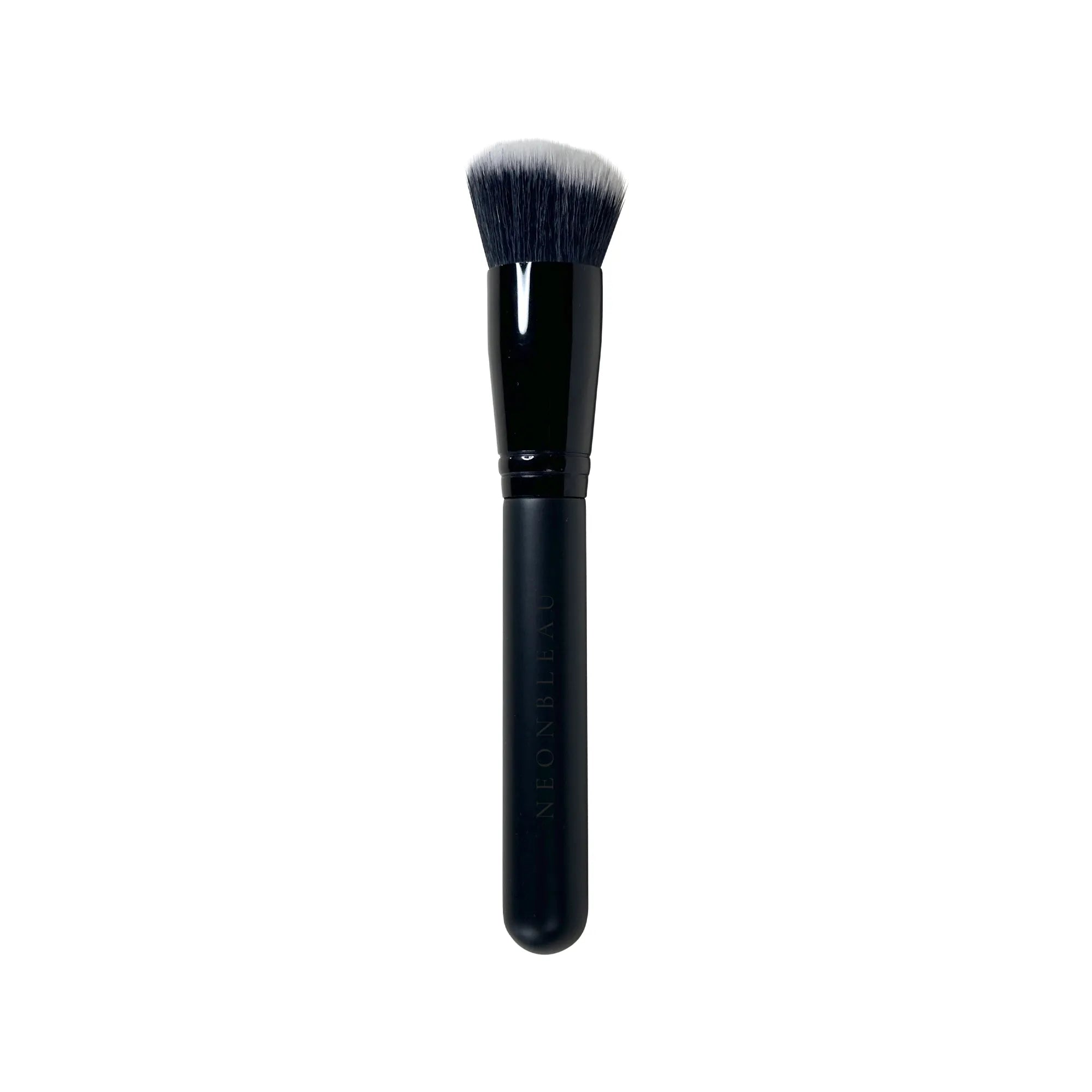 A black foundation brush with a slightly angled, two-toned black and white brush head.