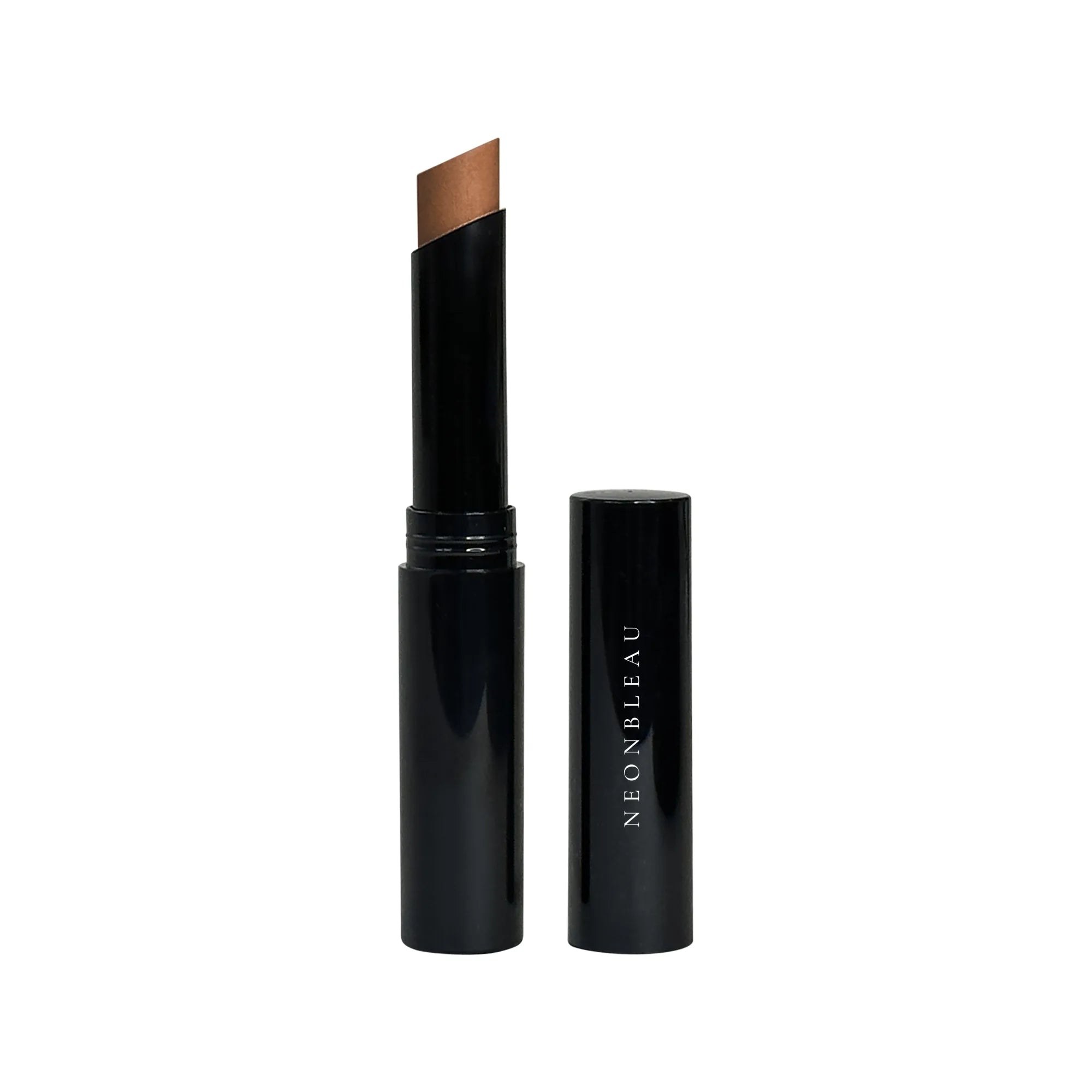An open creme concealer stick in Oak with a black tube and cap.