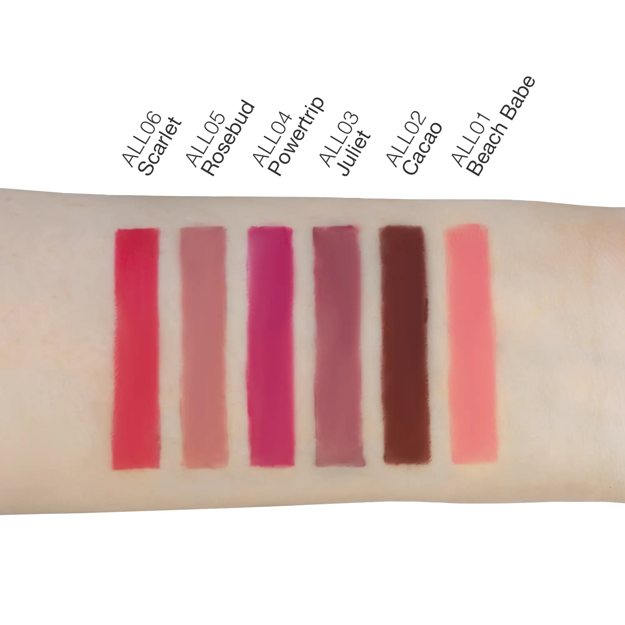 Seven lip liner swatches on an arm, labeled with shades and names.