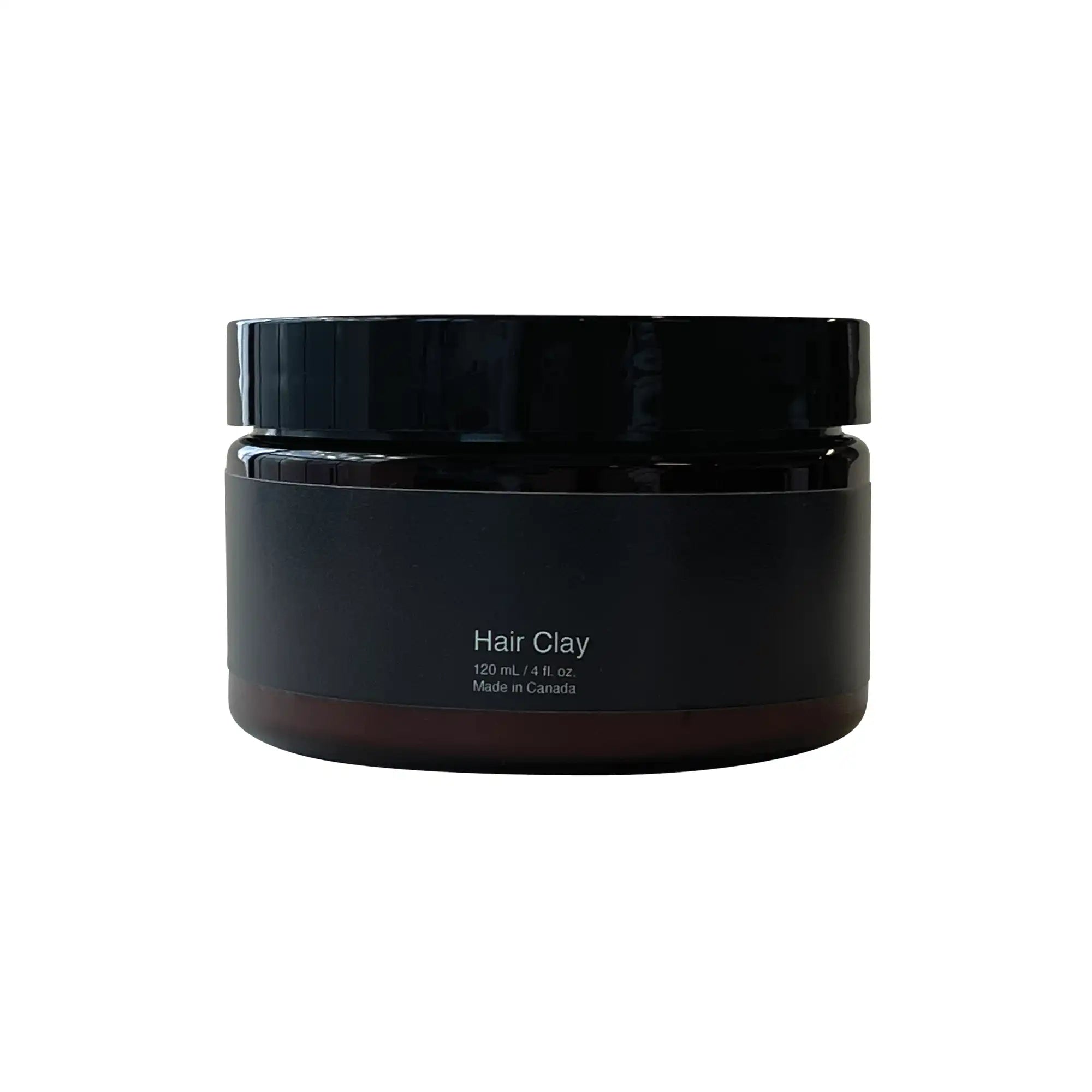 A dark brown jar of Hair Clay with a black label and lid.