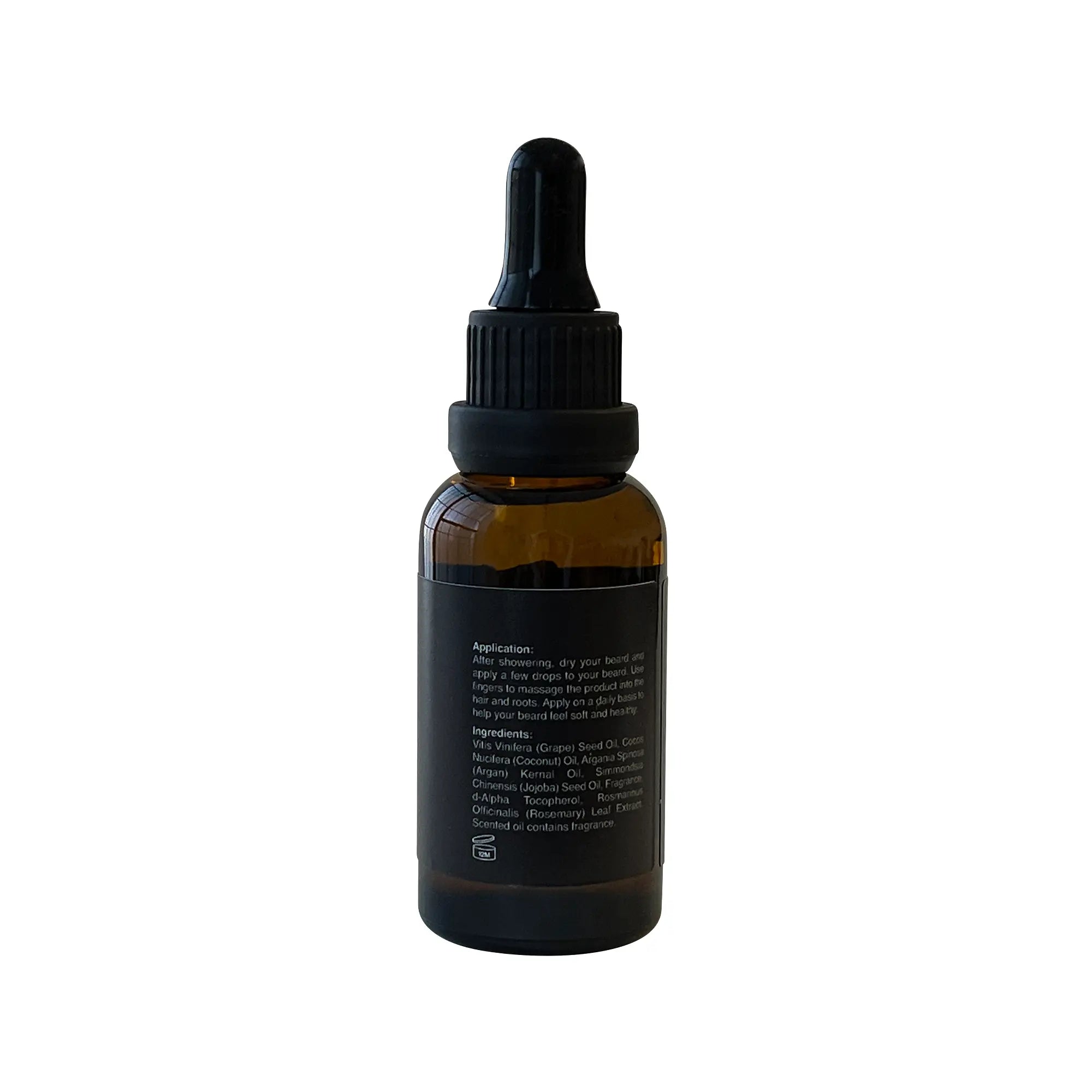 A brown glass dropper bottle of beard oil with a black label.