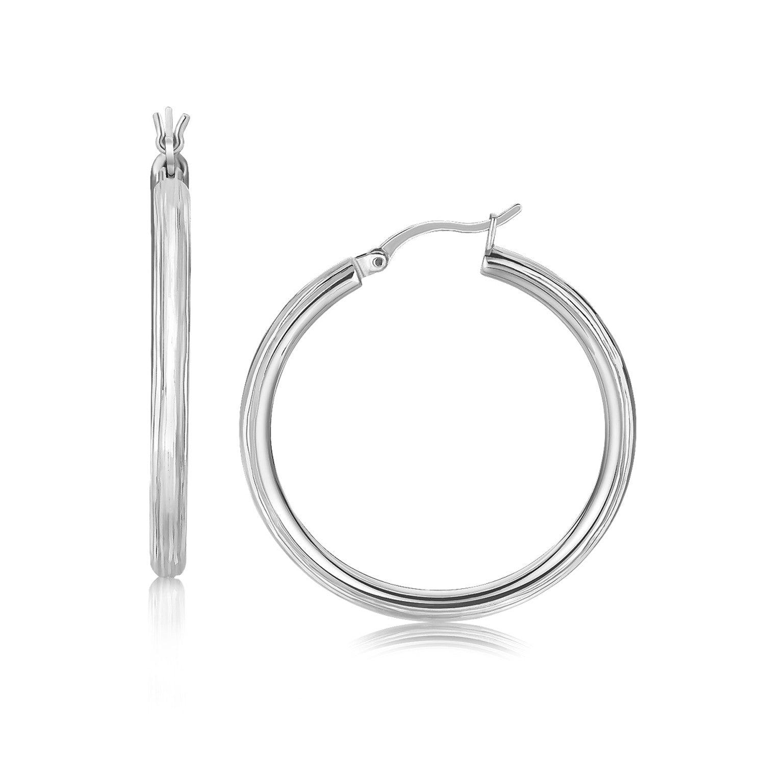 Sterling silver rhodium-plated fancy hoop earrings with diamond cuts.
