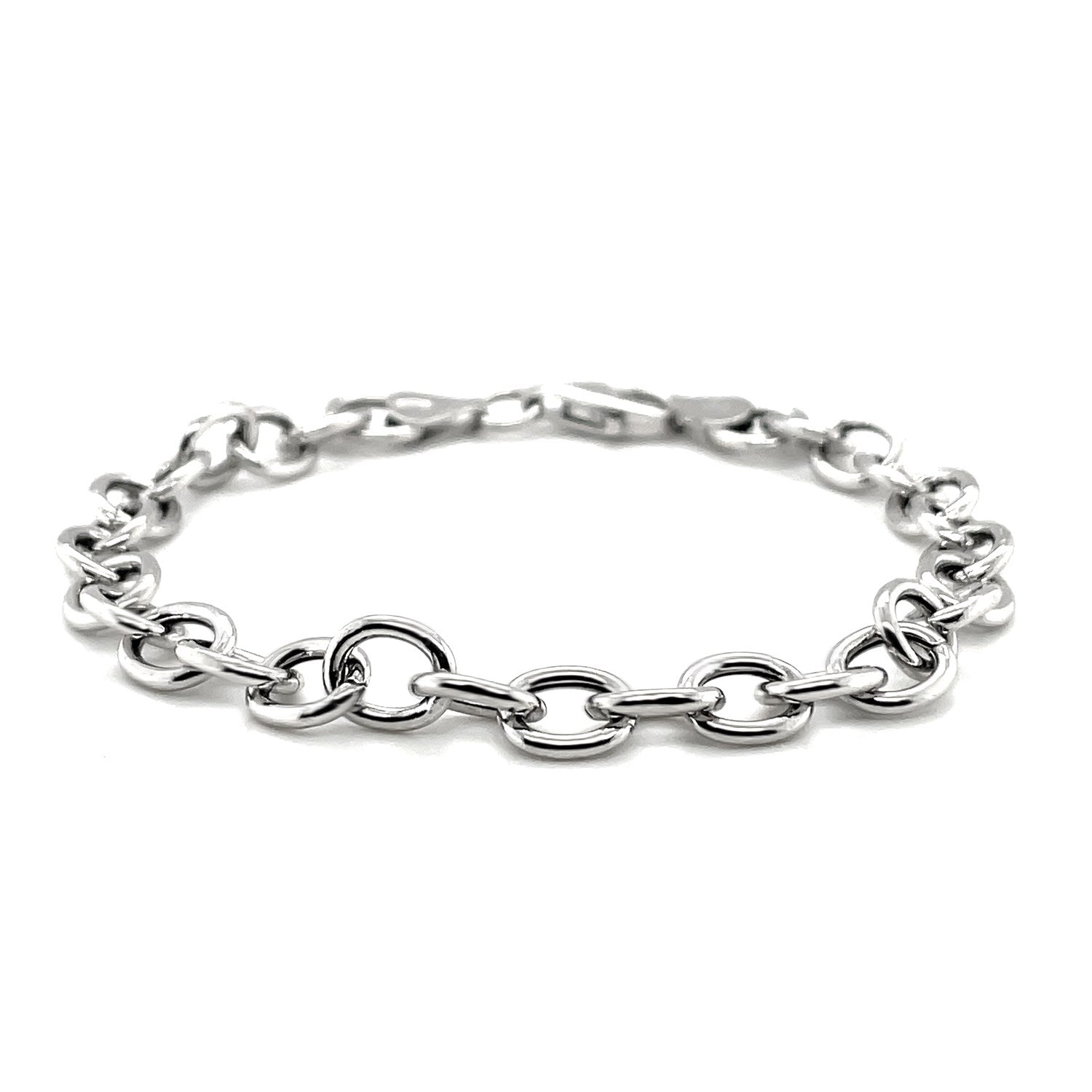 Sterling silver rhodium plated fancy charm bracelet with a lobster clasp.